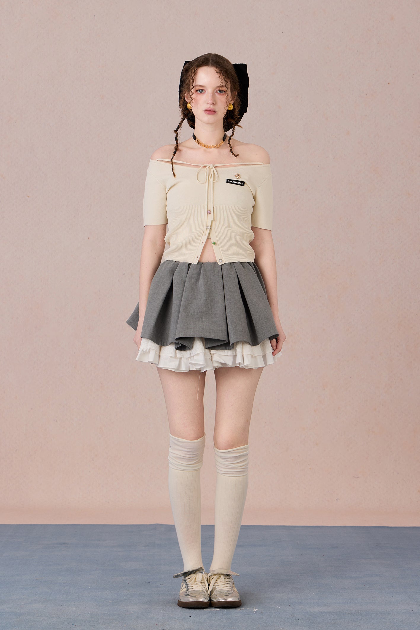 Slim bow tie top styled with trousers for evening wear