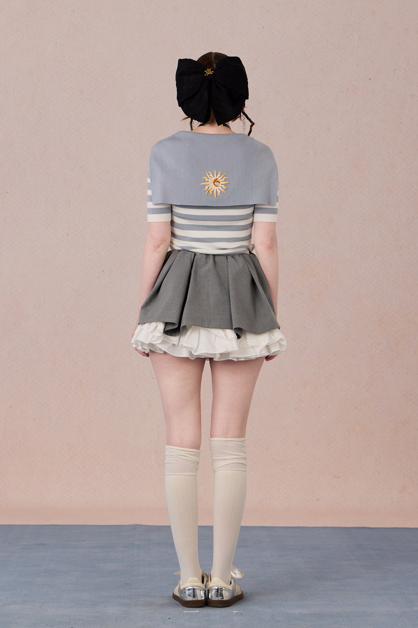  Hand-embroidered motif on striped jersey fabric