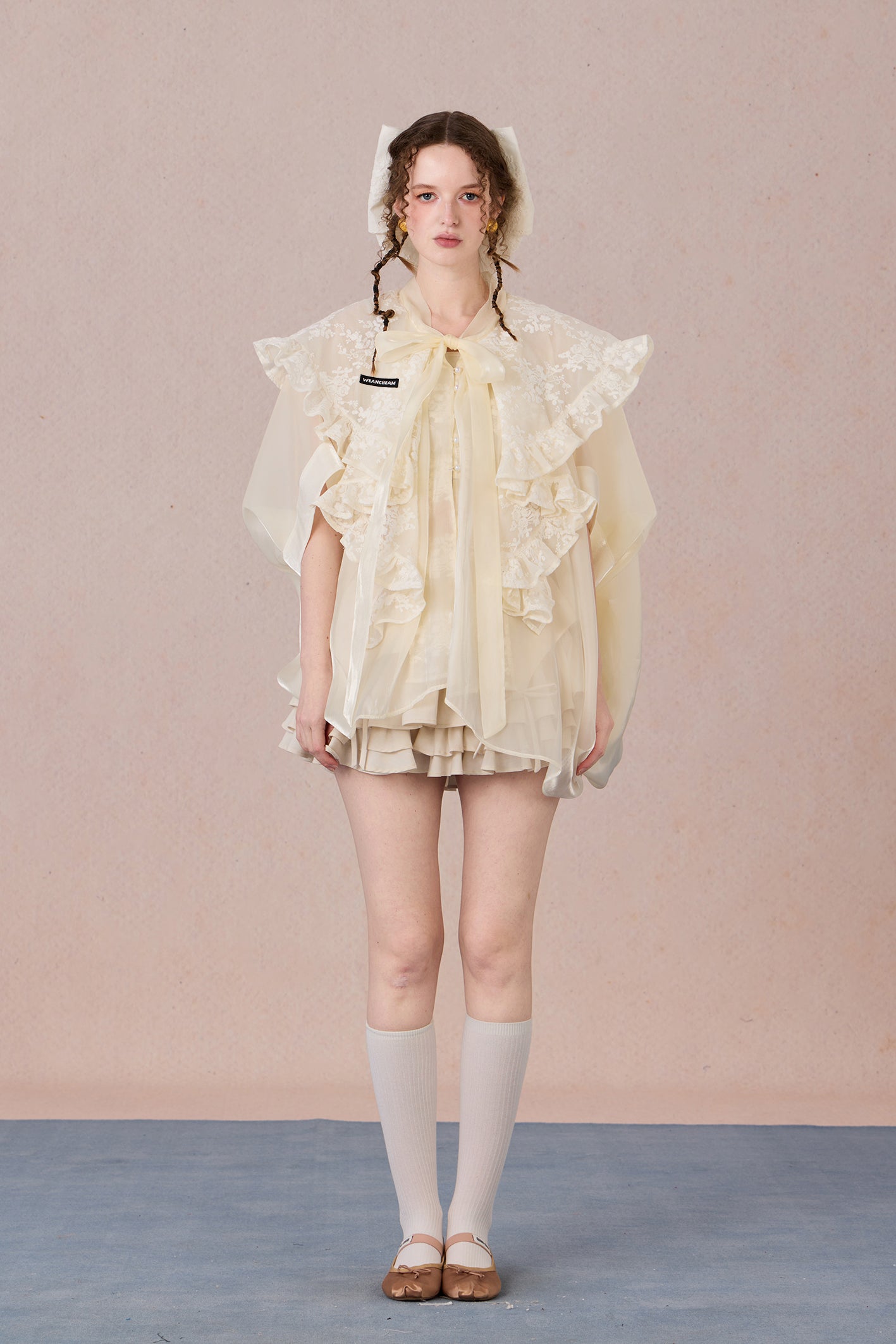 Flowing robe-style layering jacket with pearl sheen and soft lapels