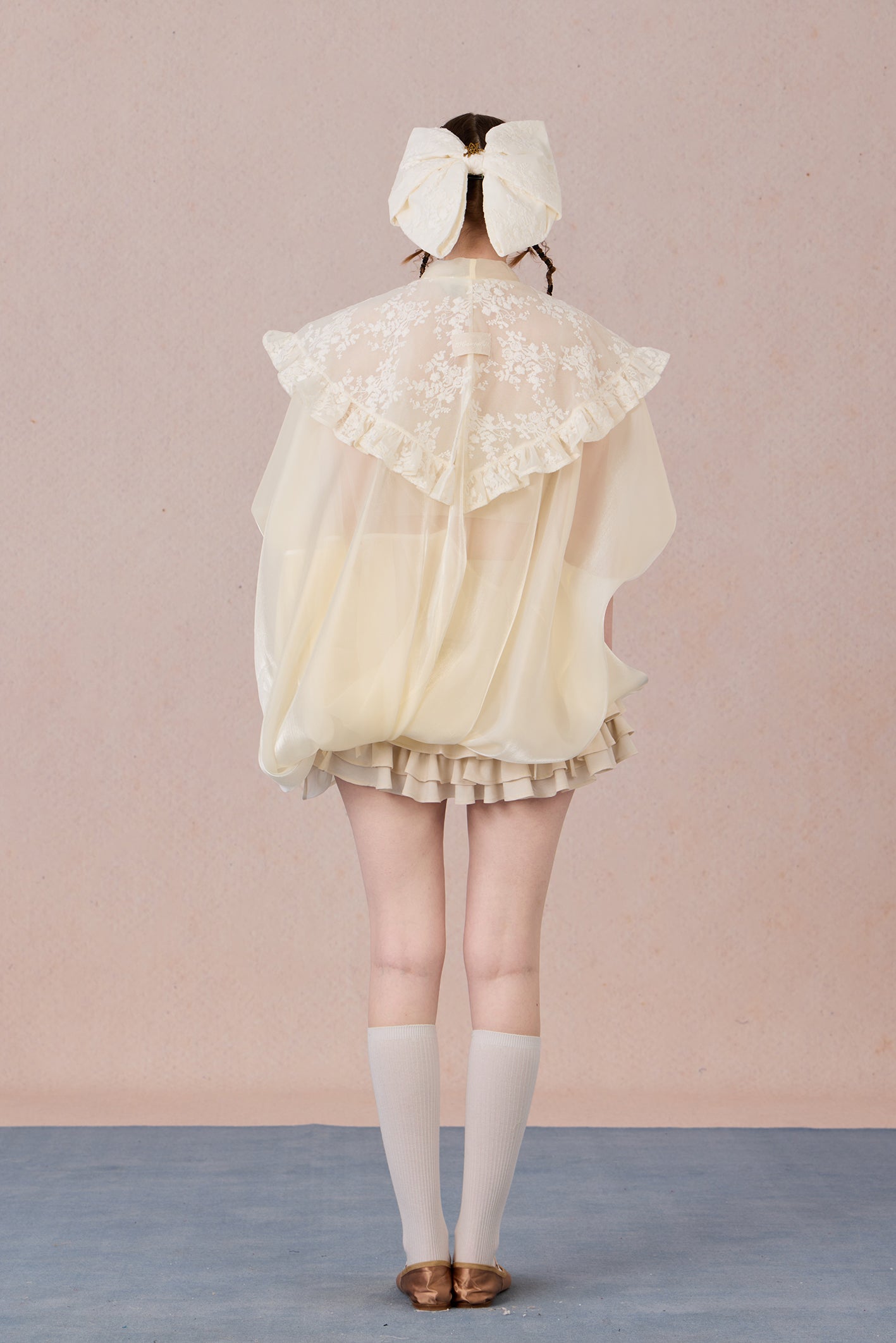 Lightweight robe coat with draped silhouette and feminine ruffle trims