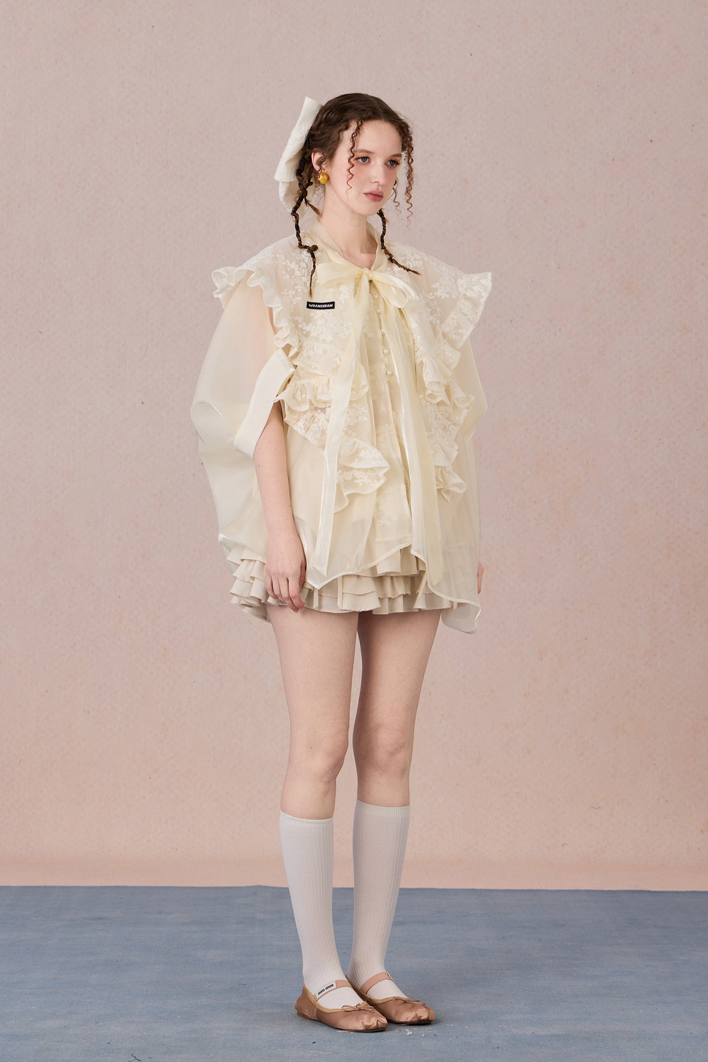 Flowing robe-style layering jacket with pearl sheen and soft lapels