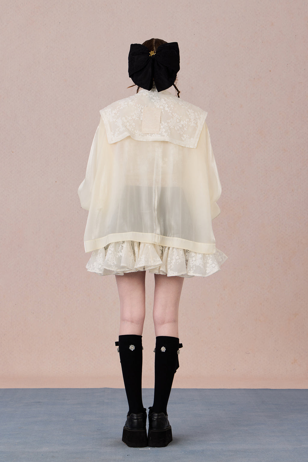 Ruffled hem chiffon jacket with lace appliqué and soft pearl luster