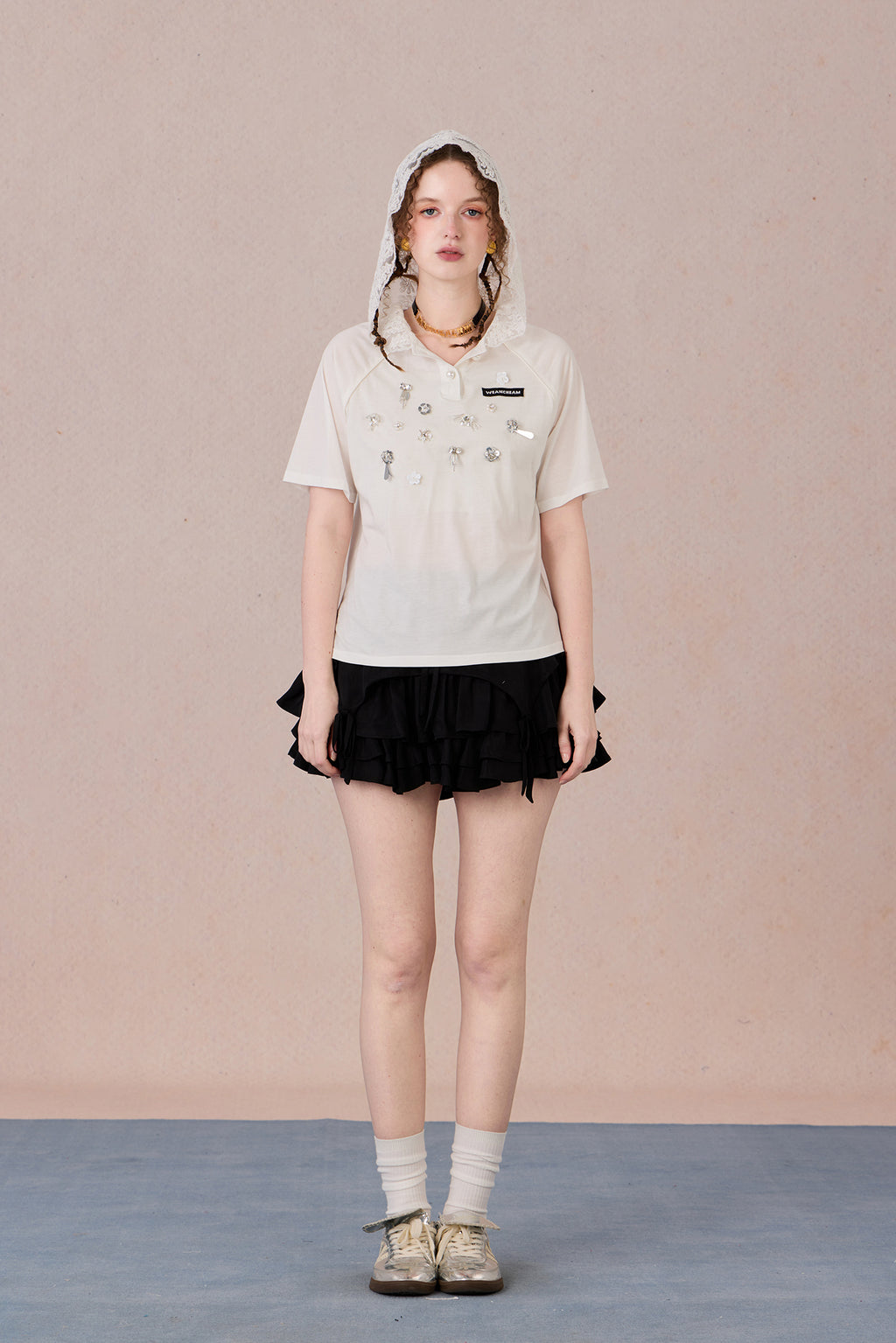 Feminine short sleeve embellished tee with soft drape and casual elegance