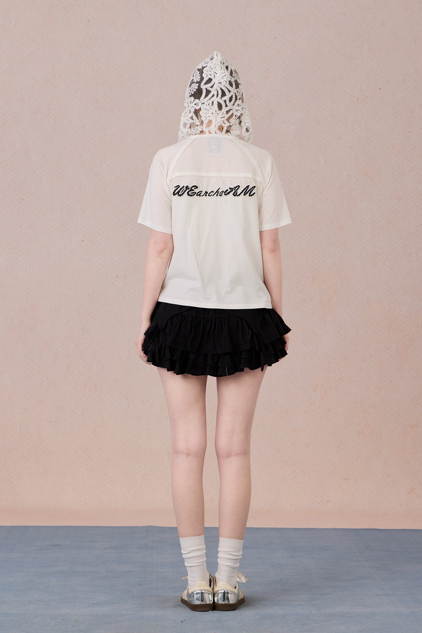 Brand logo detail and lace sleeve polo T-shirt back view