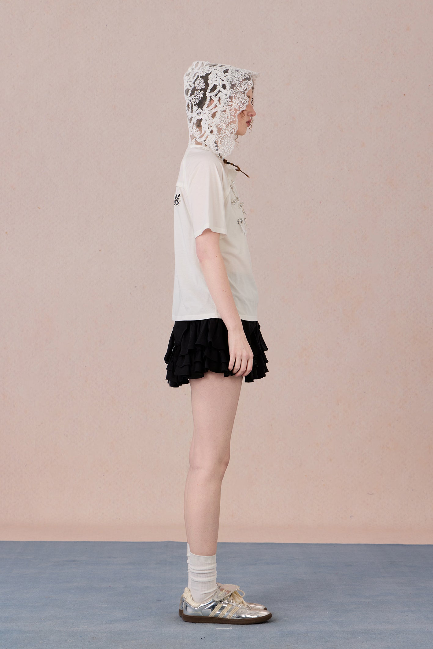 Feminine short sleeve embellished tee with soft drape and casual elegance