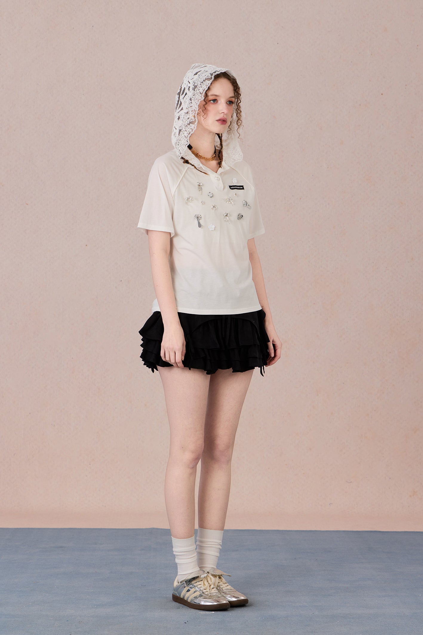 Feminine short sleeve embellished tee with soft drape and casual elegance