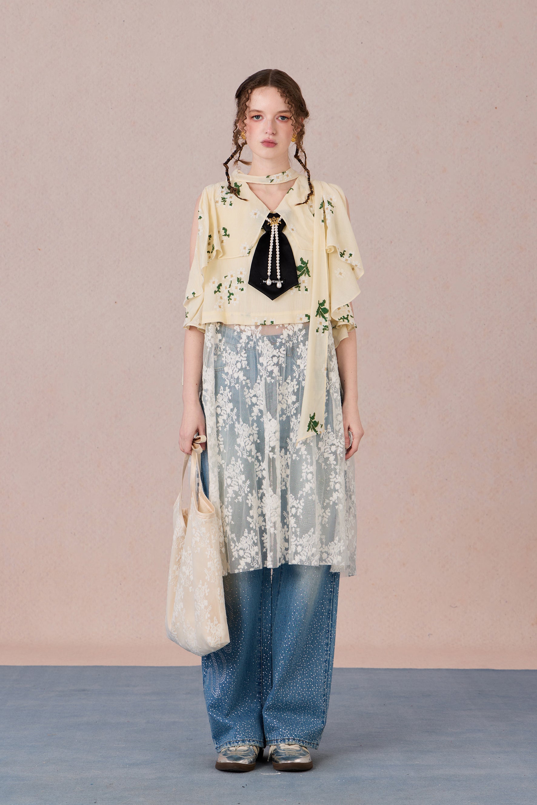 Model in semi-sheer layered blouse with contrast fabric and pearl detail – WEANCHEAM
