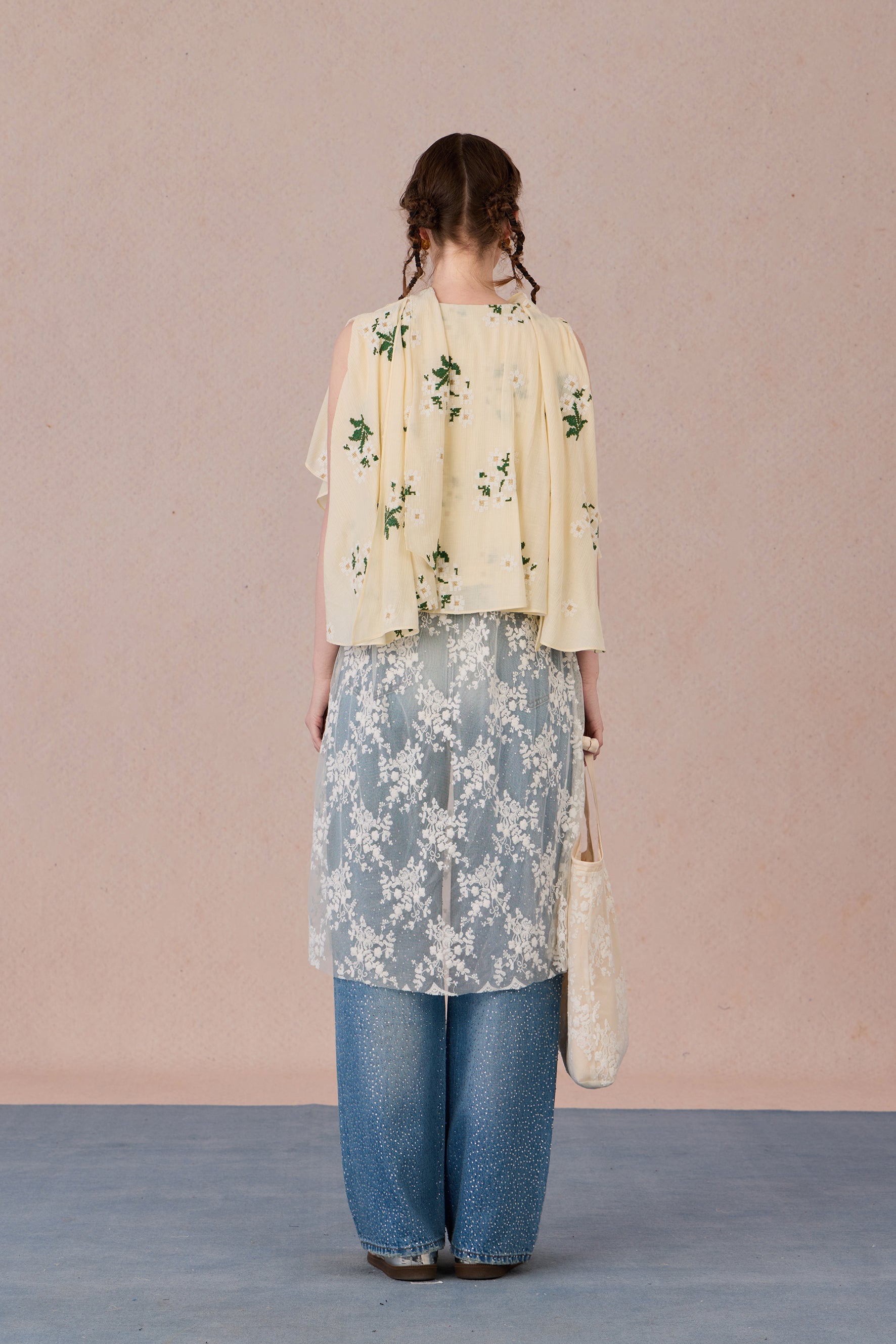 Back view of lightweight sheer-hem blouse with relaxed drape – WEANCHEAM