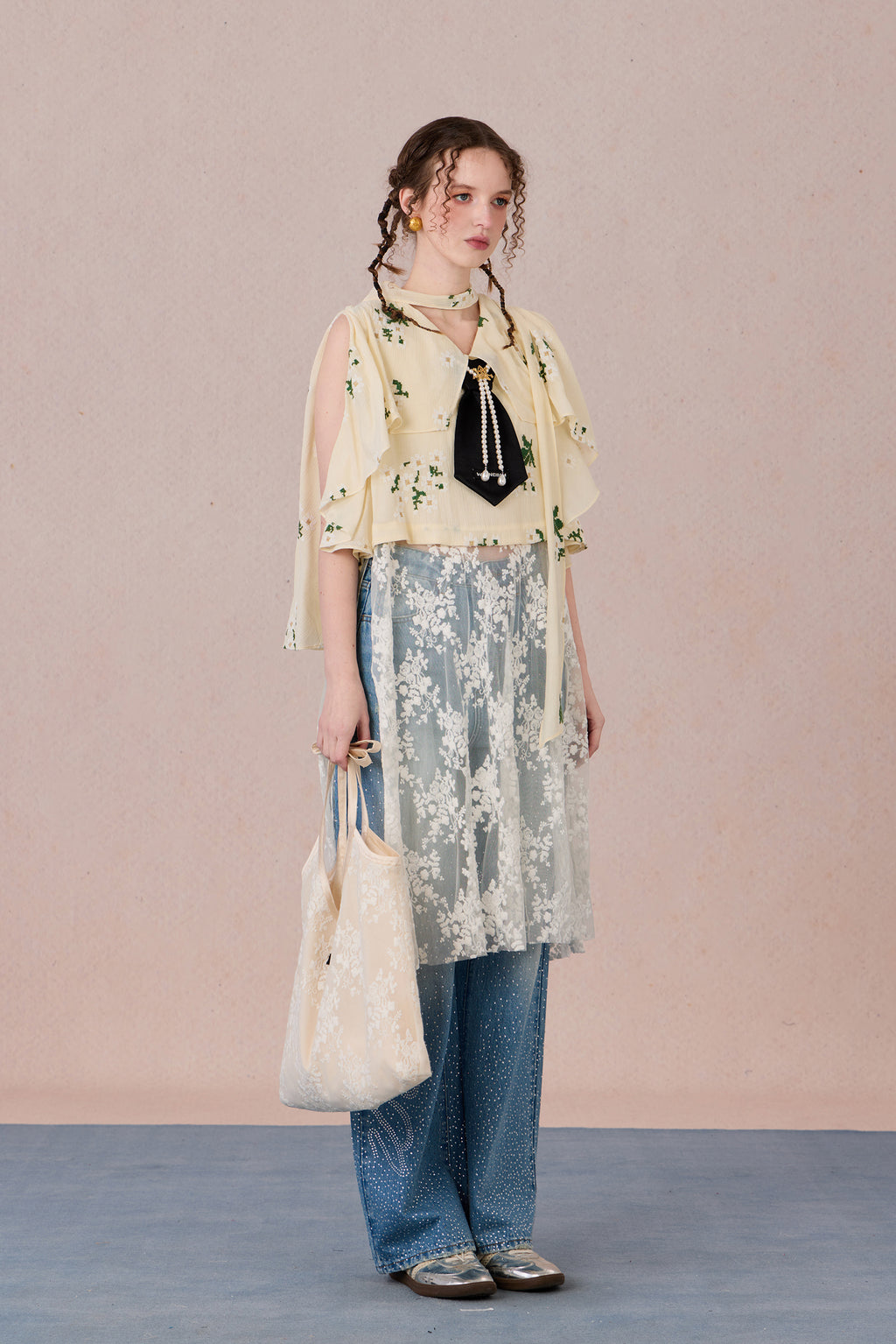 Model in semi-sheer layered blouse with contrast fabric and pearl detail – WEANCHEAM