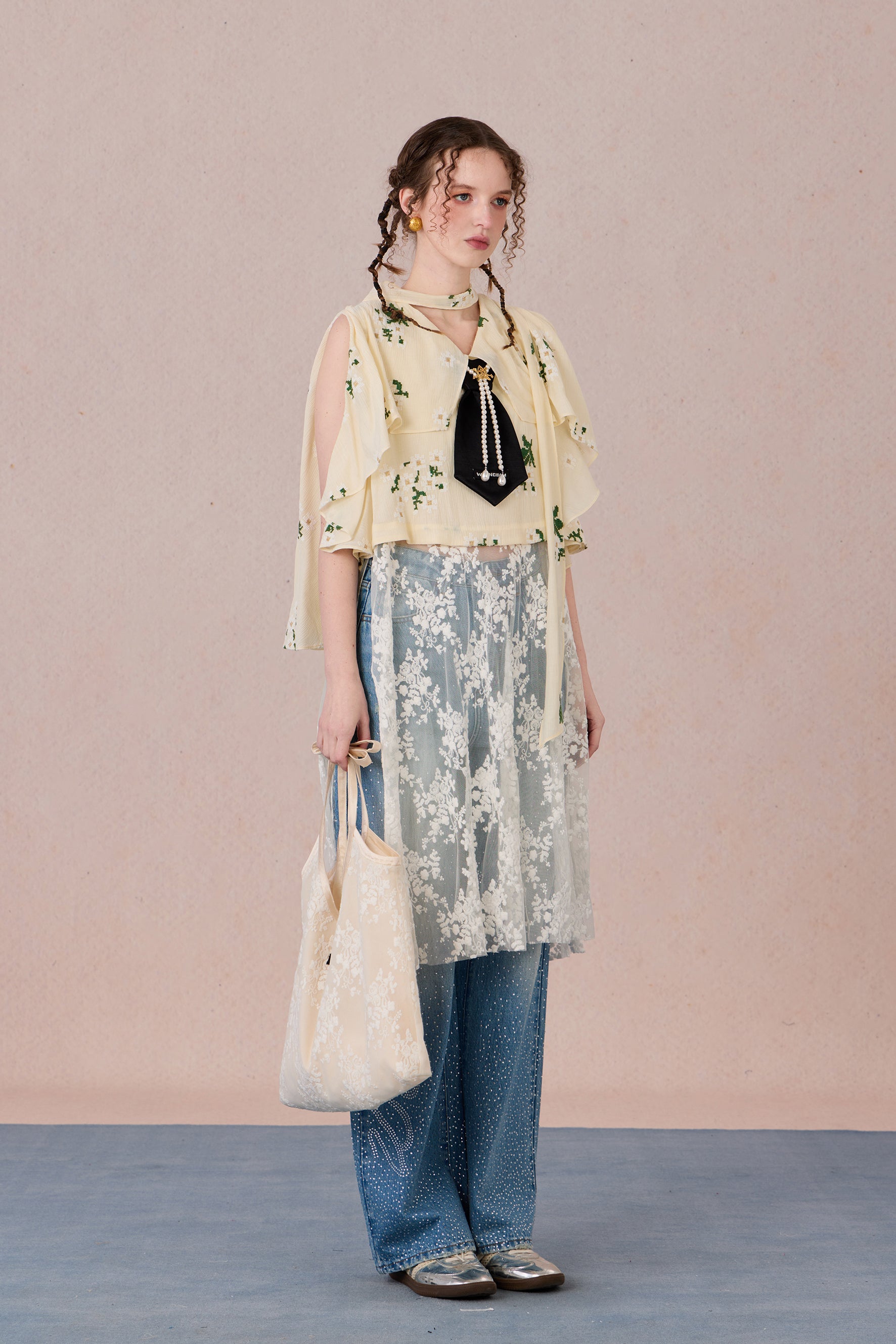 Model in semi-sheer layered blouse with contrast fabric and pearl detail – WEANCHEAM