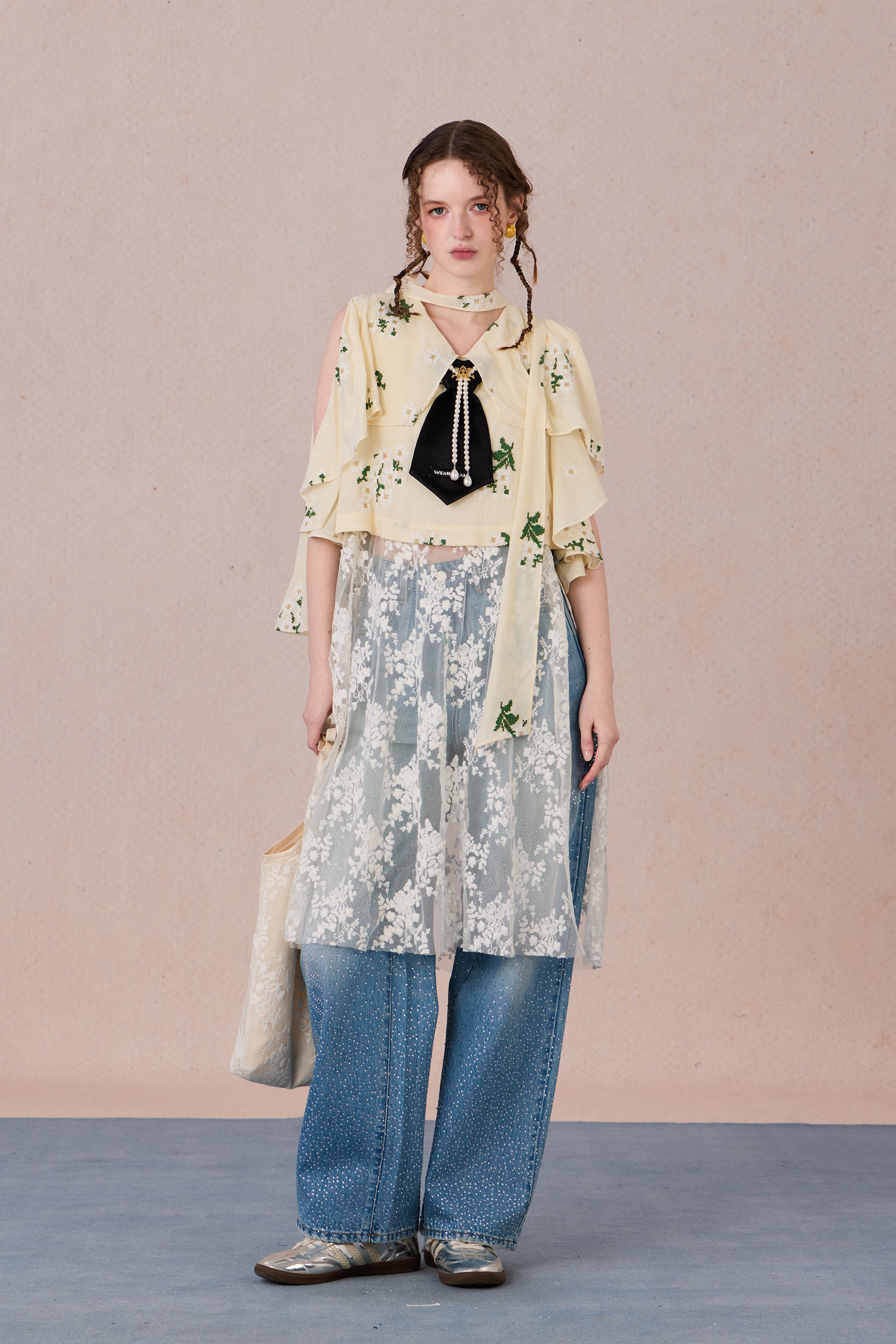 Model in semi-sheer layered blouse with contrast fabric and pearl detail – WEANCHEAM