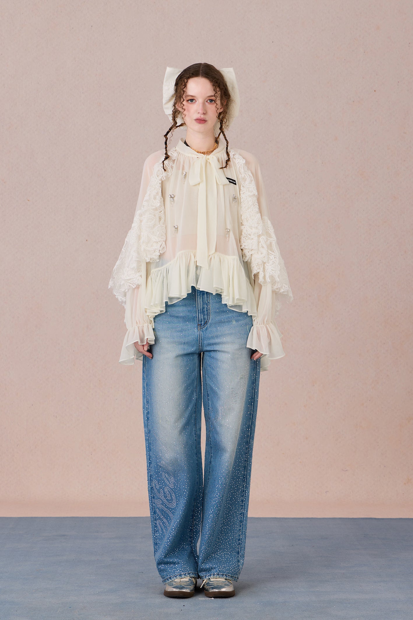 Sheer romantic blouse with flowing silhouette and tulle texture