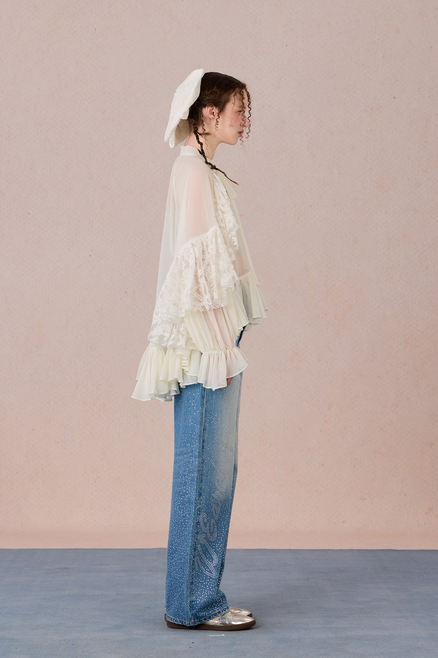 Sheer romantic blouse with flowing silhouette and tulle texture