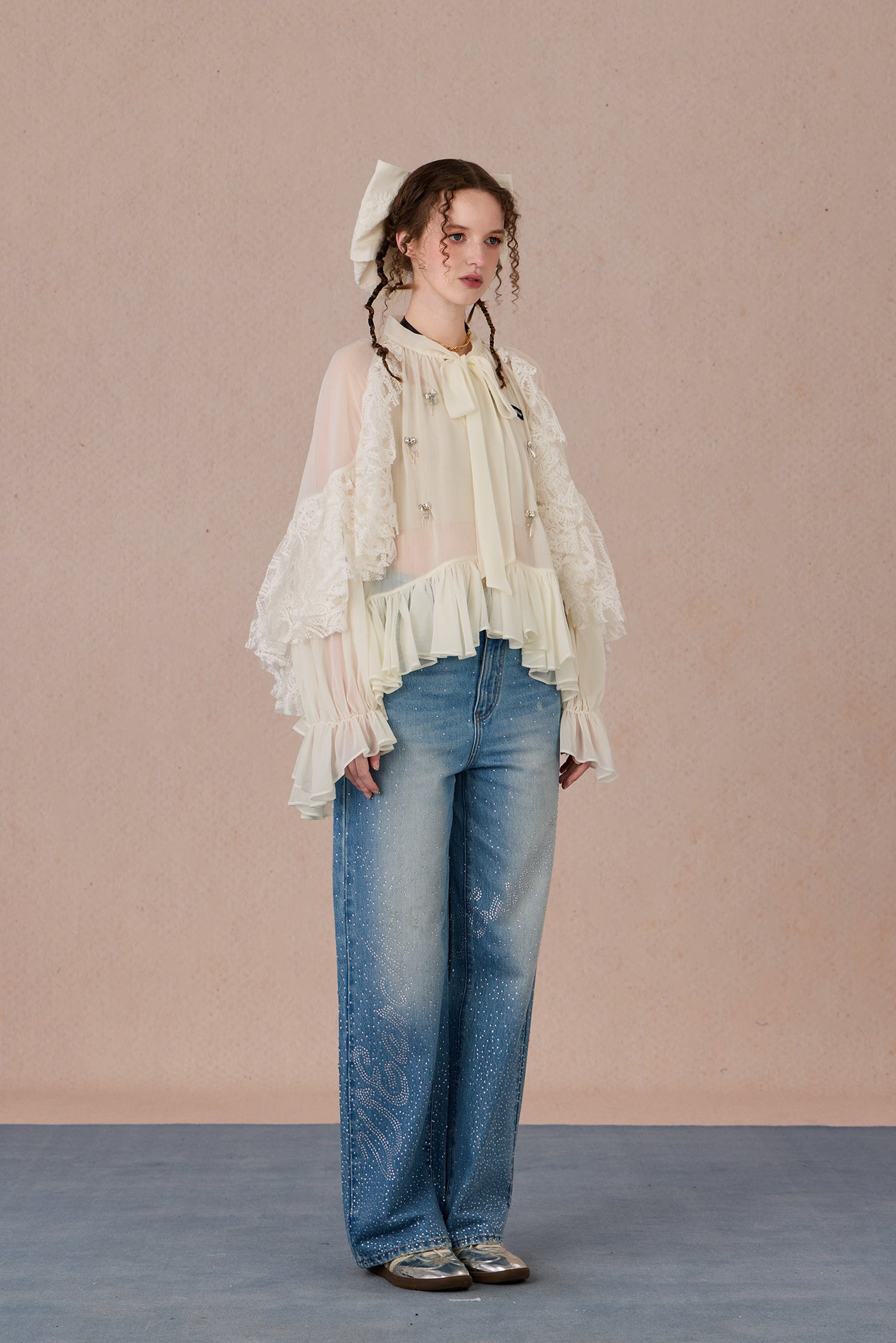 Sheer romantic blouse with flowing silhouette and tulle texture