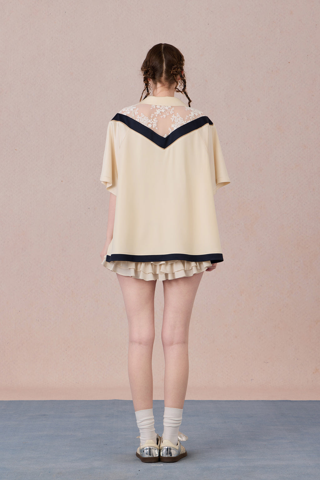 Feminine streetwear tee with mesh panels and loose fit