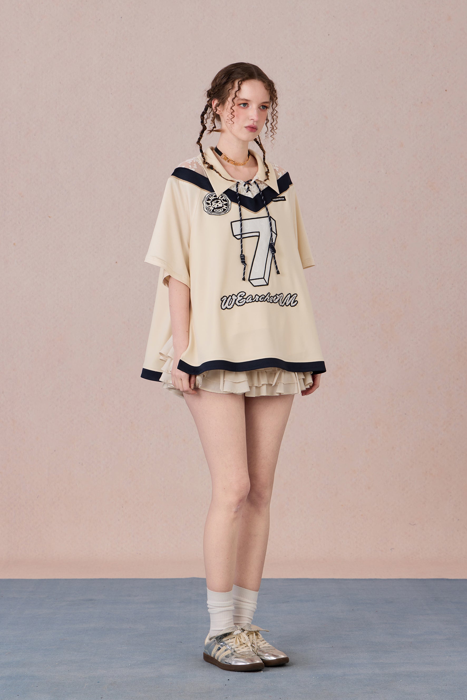 Feminine streetwear tee with mesh panels and loose fit