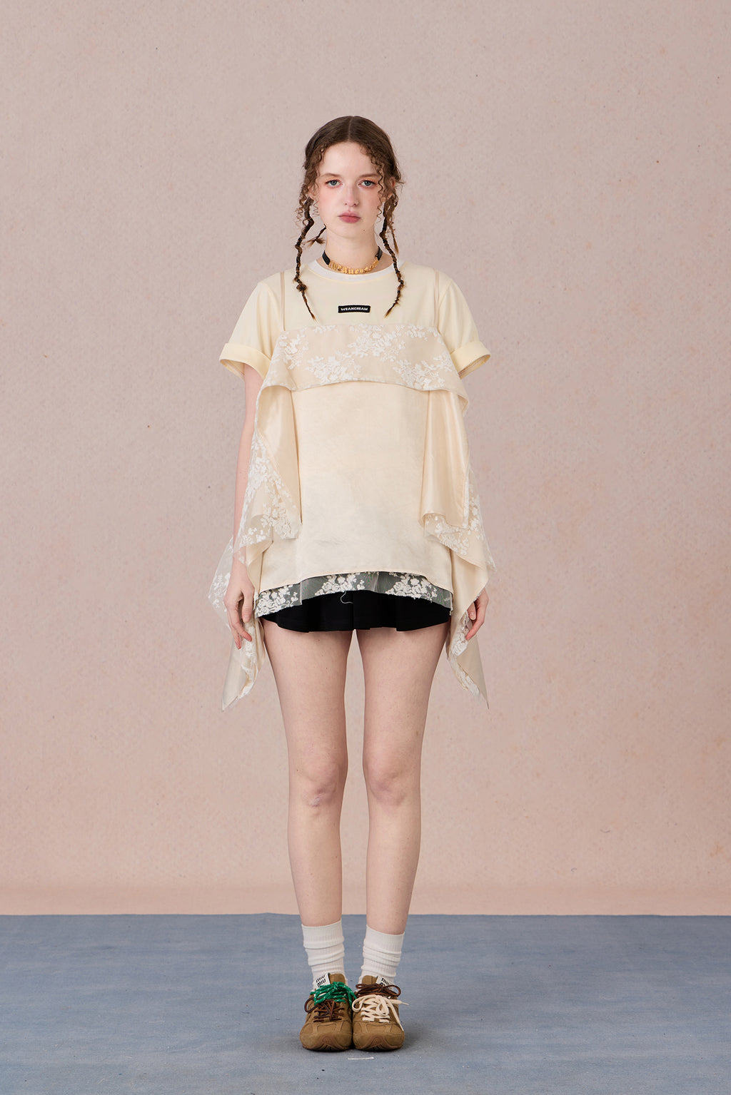 Romantic two-piece look blouse paired with trousers