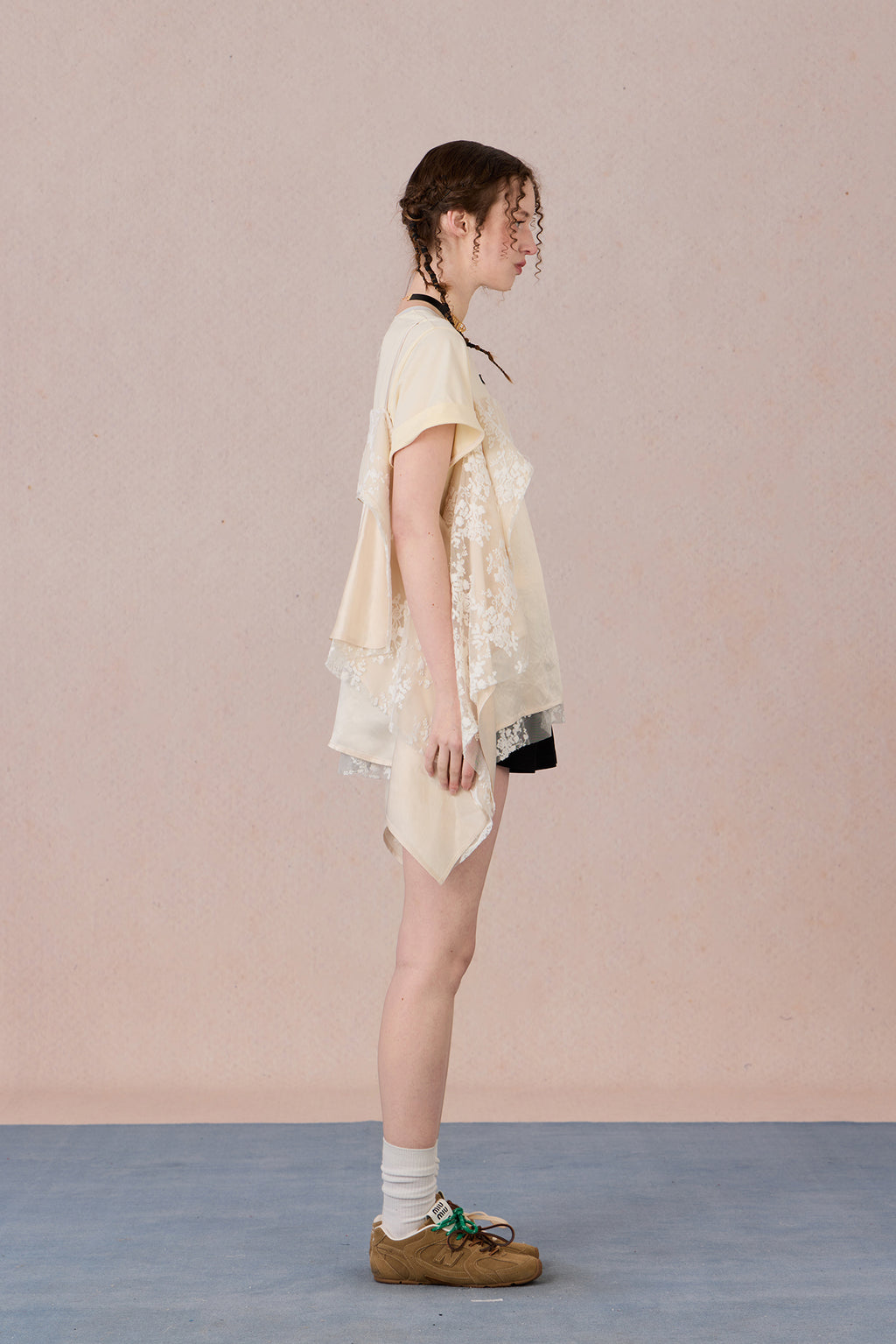 Romantic two-piece look blouse paired with trousers
