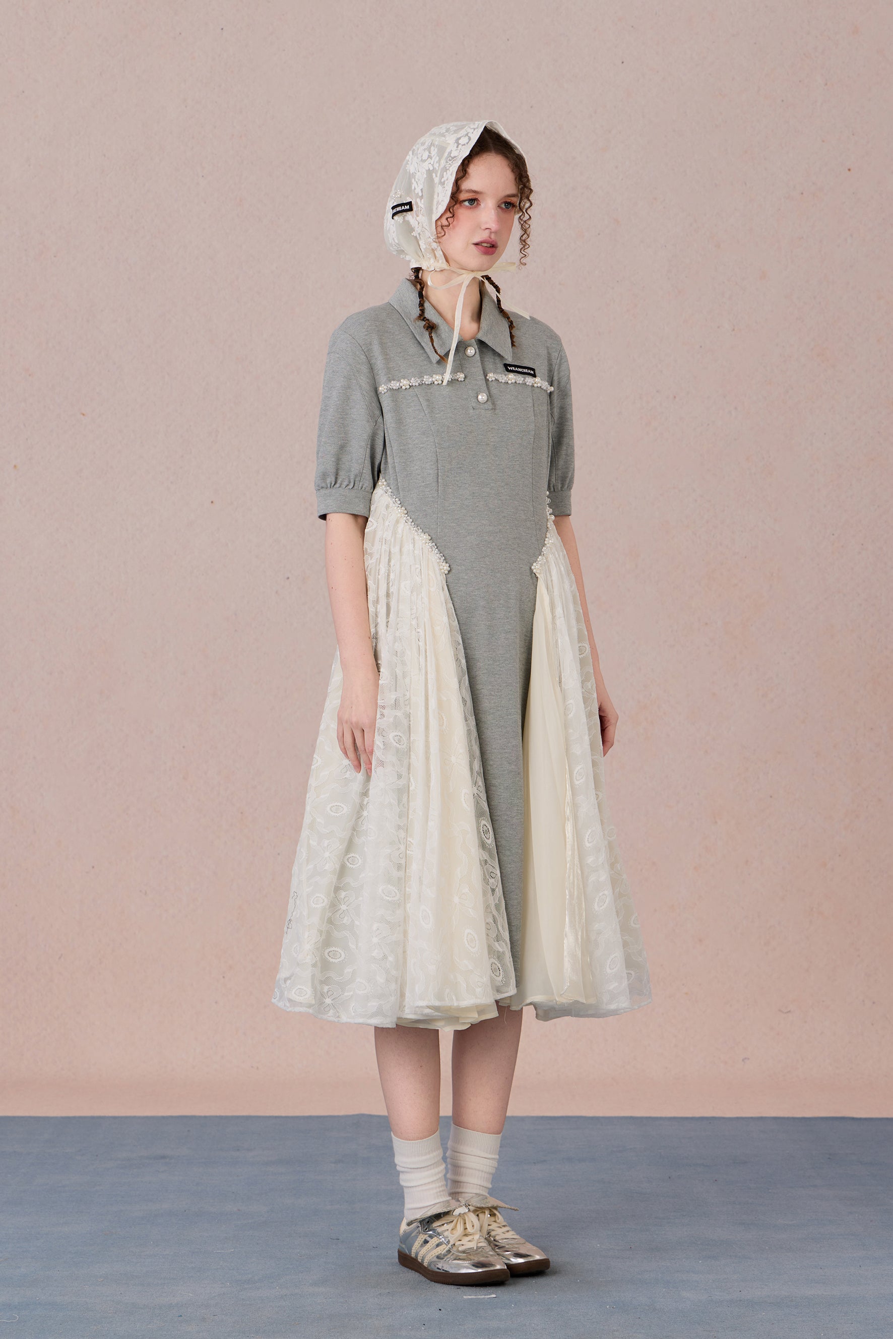 	Model wearing lace-trimmed polo midi dress with pearl accents – WEANCHEAM