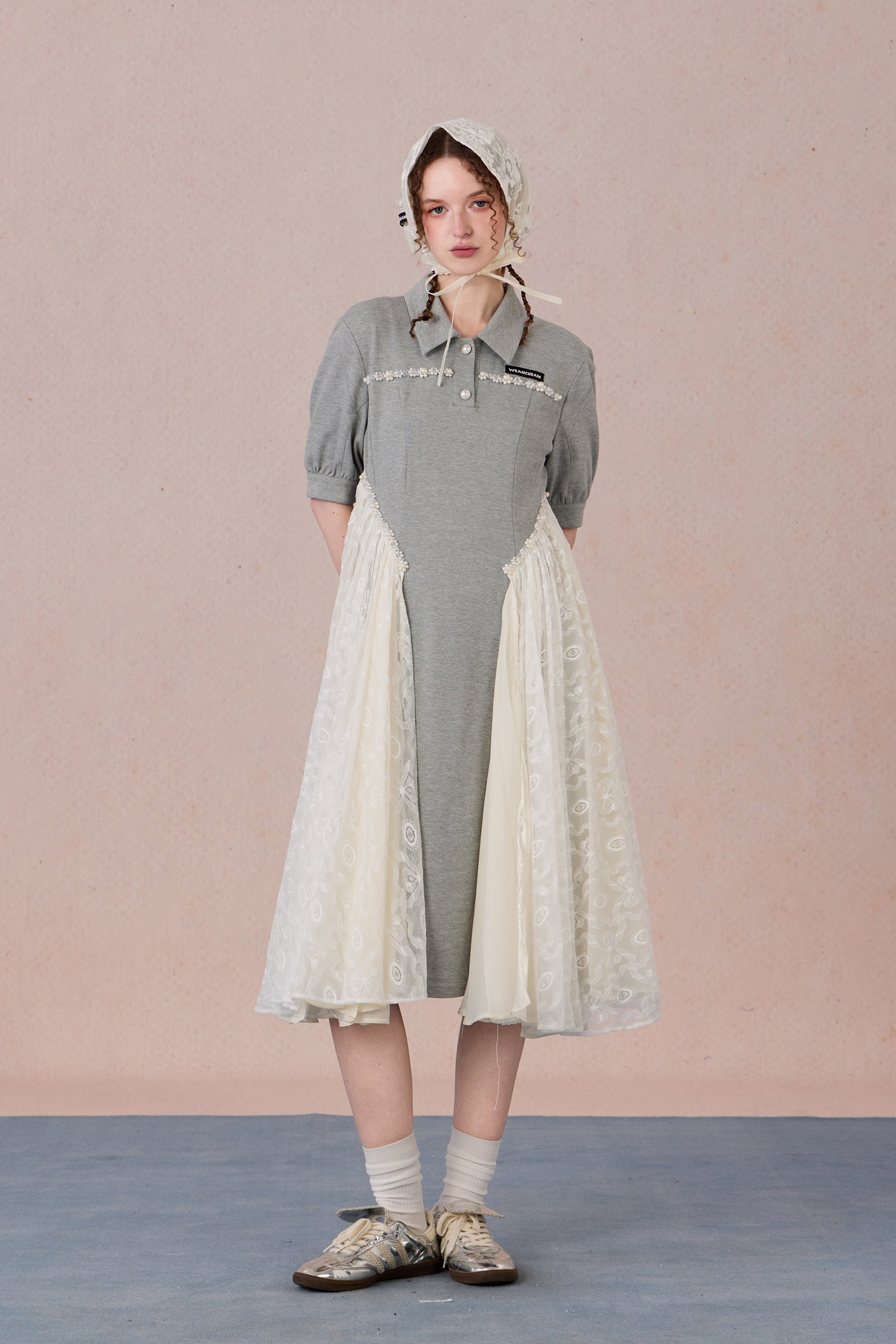 	Model wearing lace-trimmed polo midi dress with pearl accents – WEANCHEAM