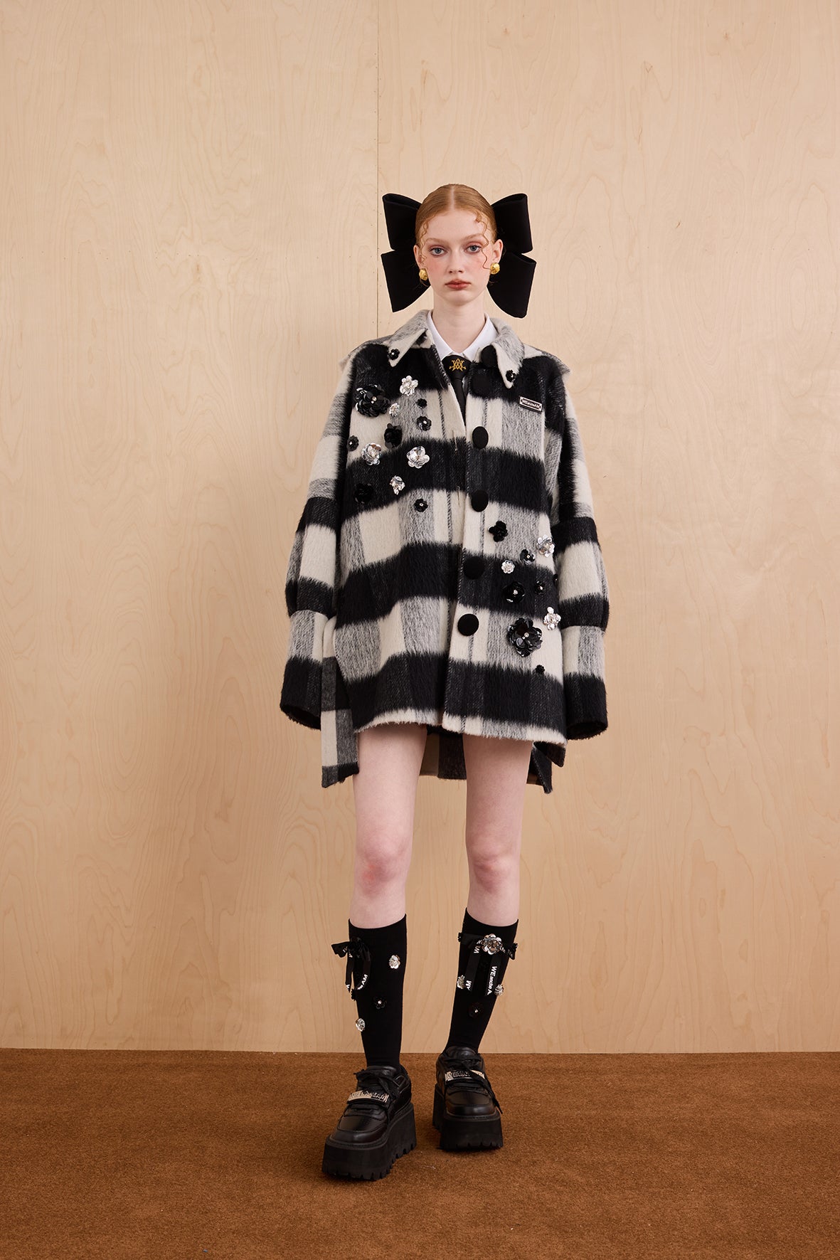 Model wearing merino wool reversible hoodie jacket with cat ears and bows