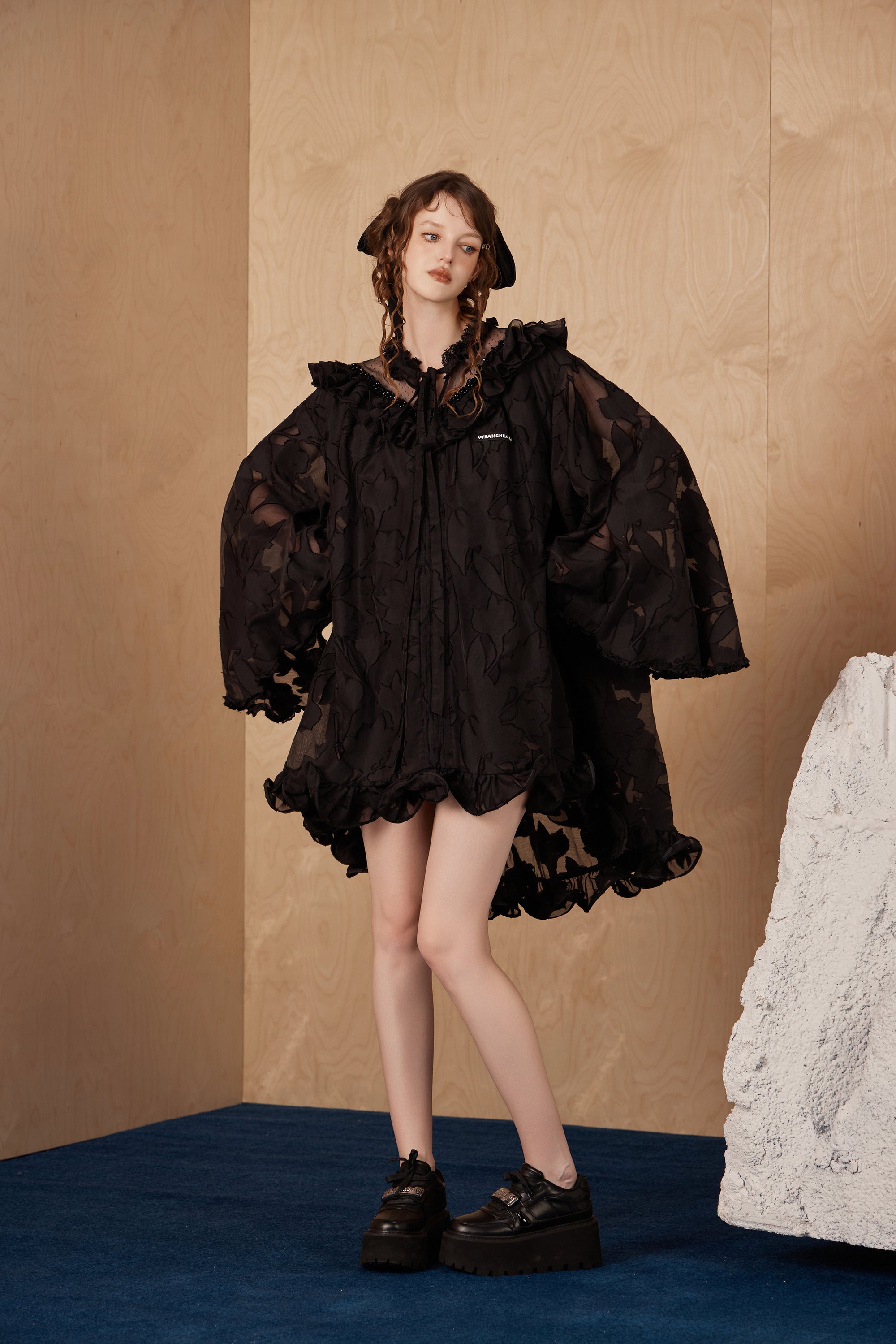 Model wearing fishbone lace dress with vintage-inspired elegance and lace trim