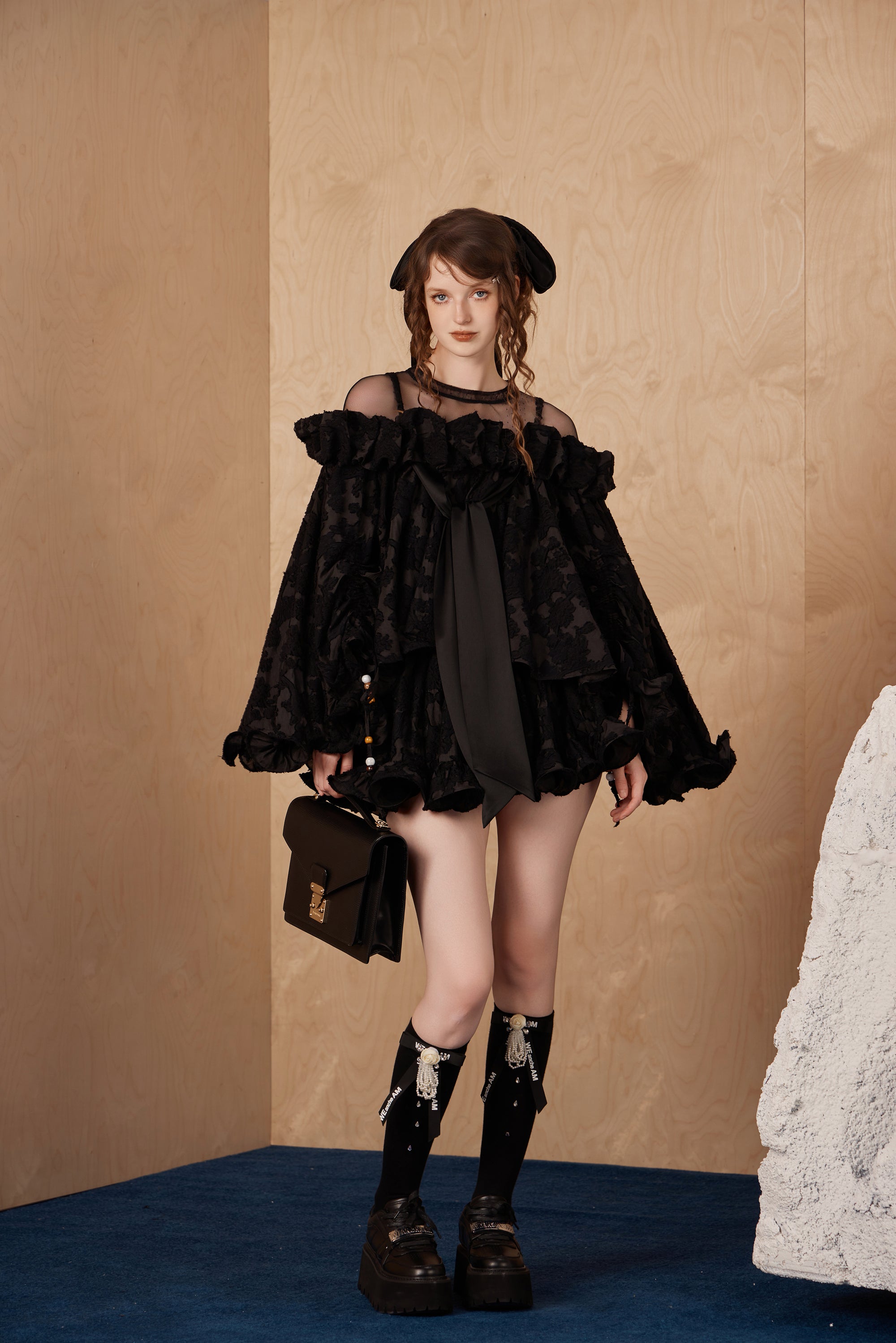 Model wearing lace hem short pencil skirt with semi-sheer custom prints