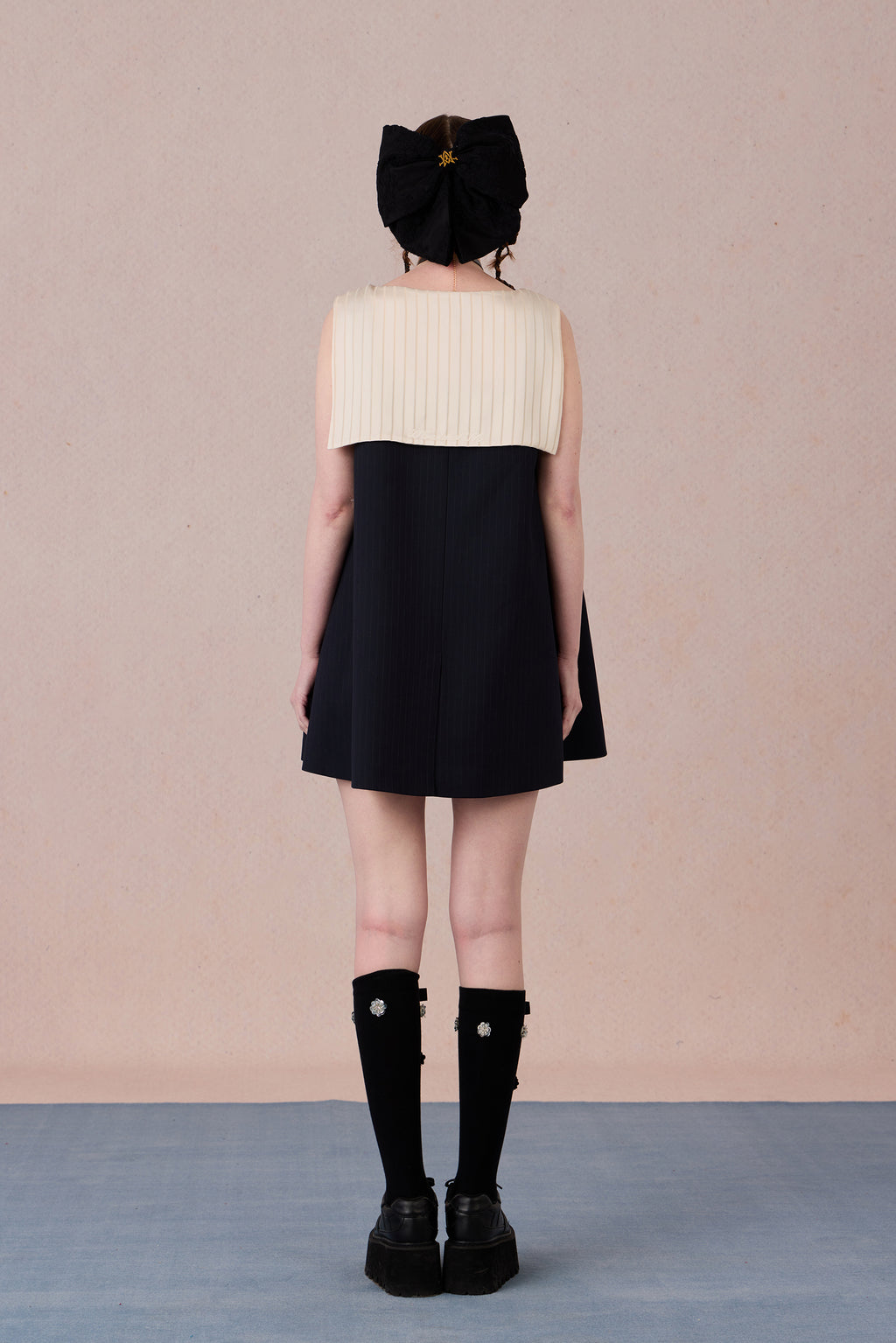 Relaxed fit back view of button-down lace trimmed denim dress