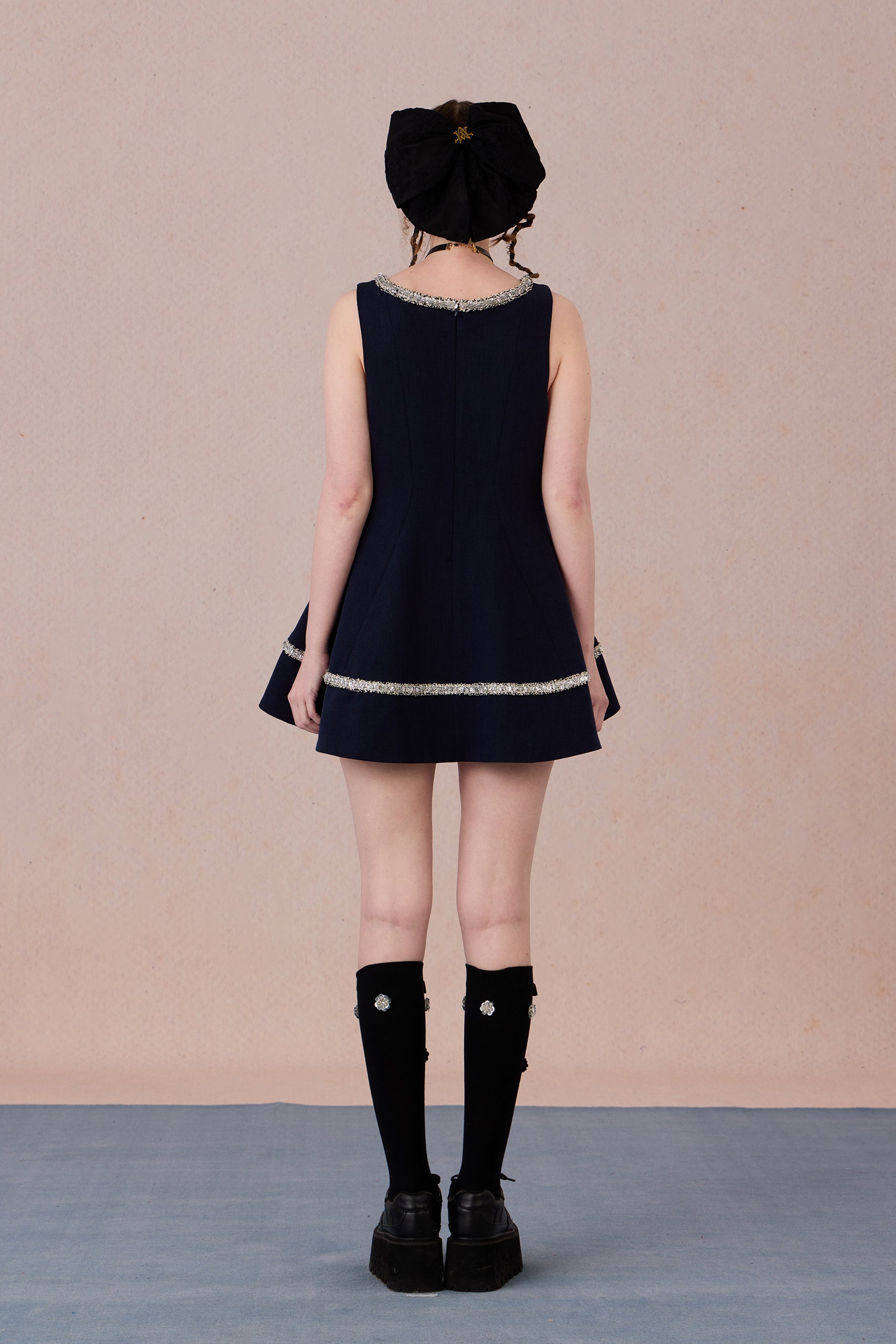  Elegant structured evening dress with shimmer embellishments and flattering silhouette