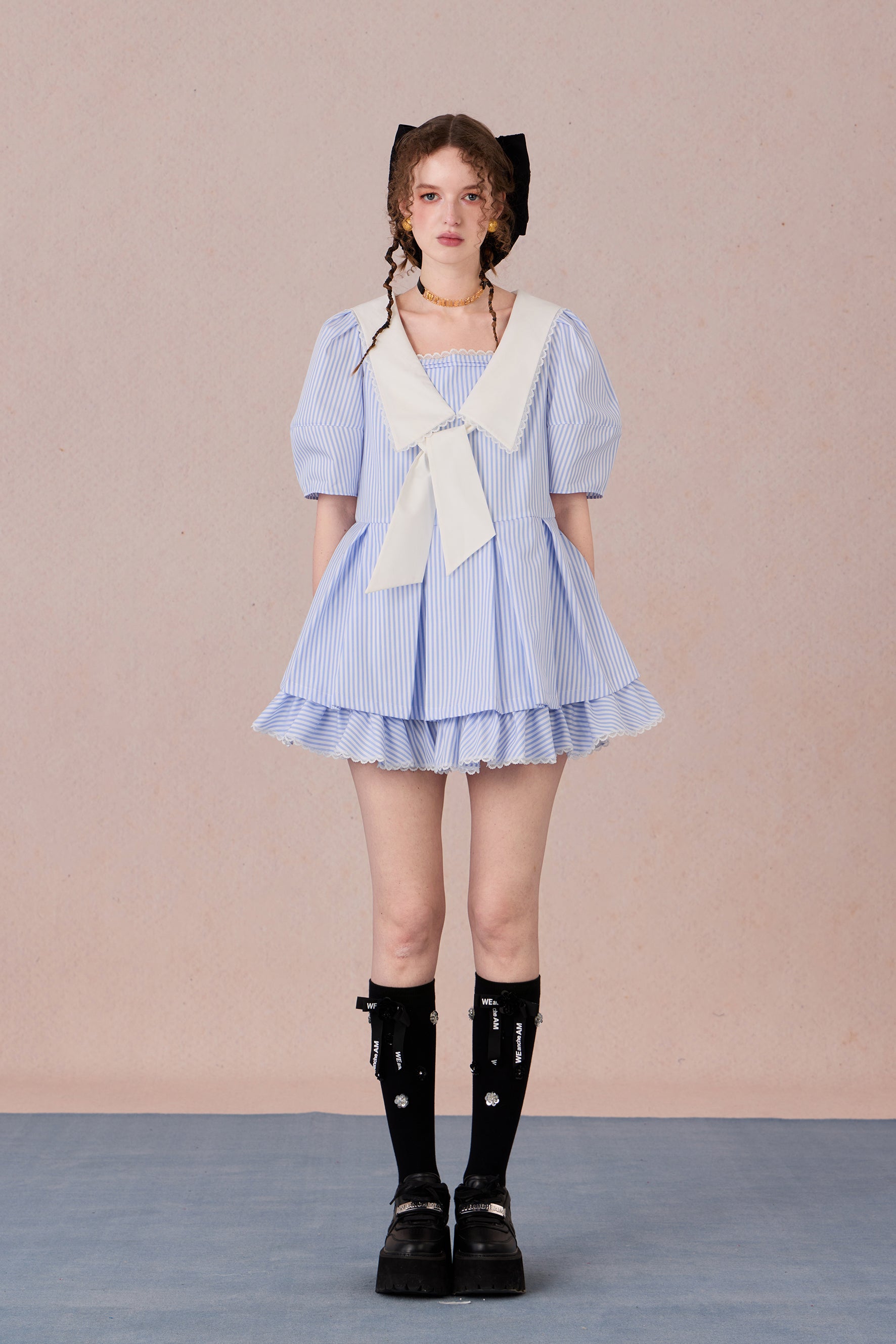 Vintage puff sleeve dress with ruffle hem and tie-neck detail