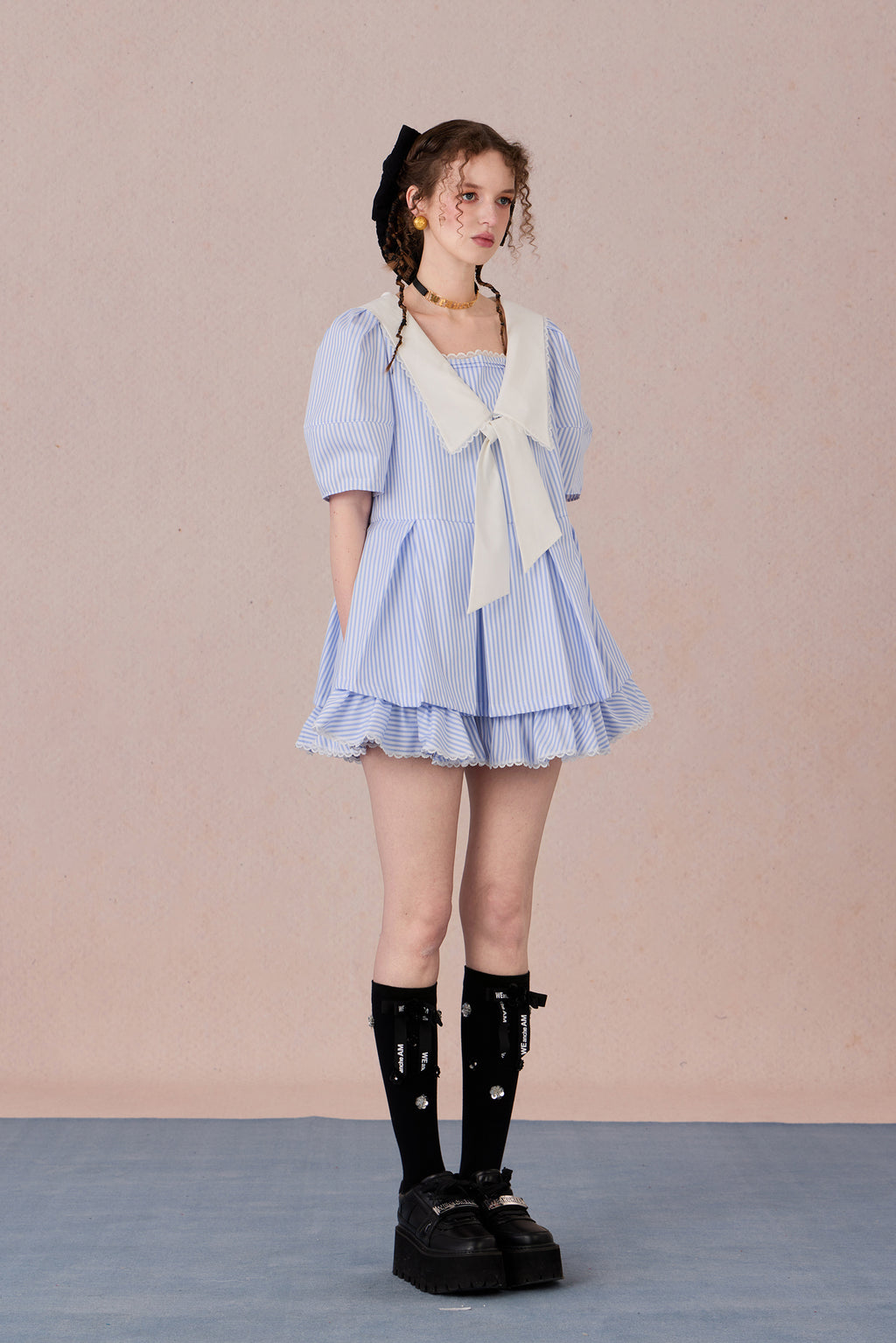  Vintage puff sleeve dress with ruffle hem and tie-neck detail