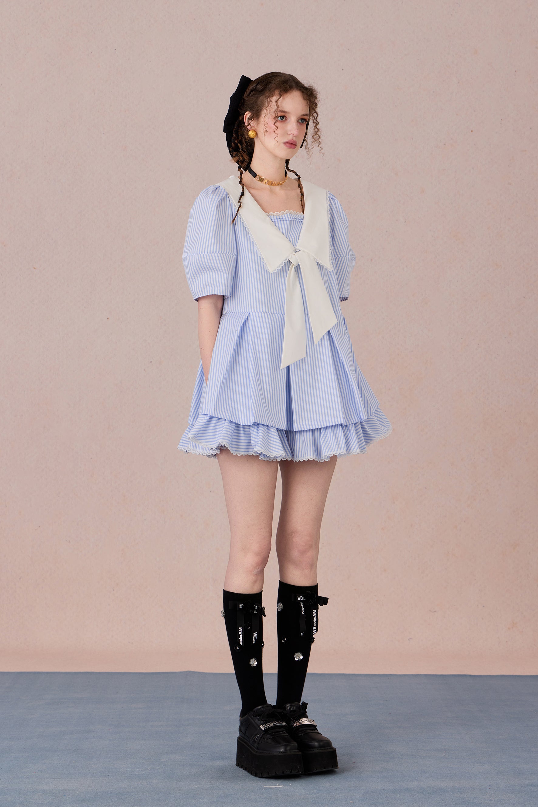  Vintage puff sleeve dress with ruffle hem and tie-neck detail