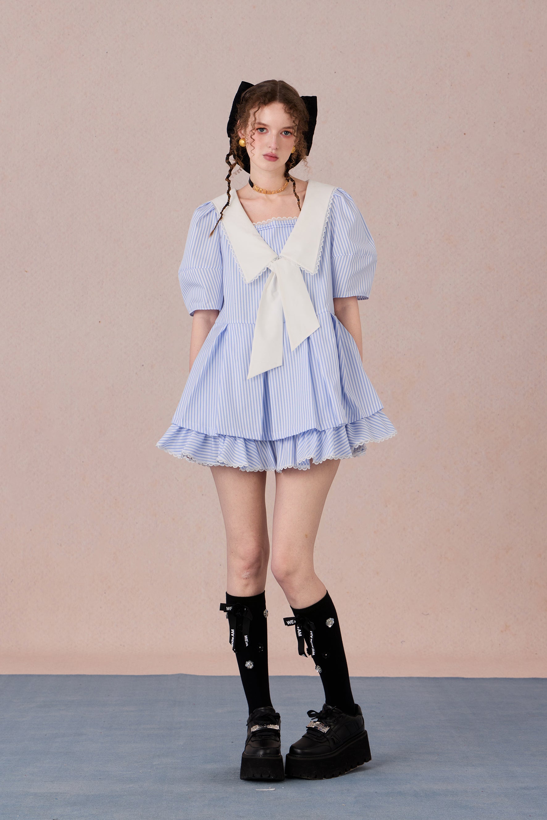  Vintage puff sleeve dress with ruffle hem and tie-neck detail