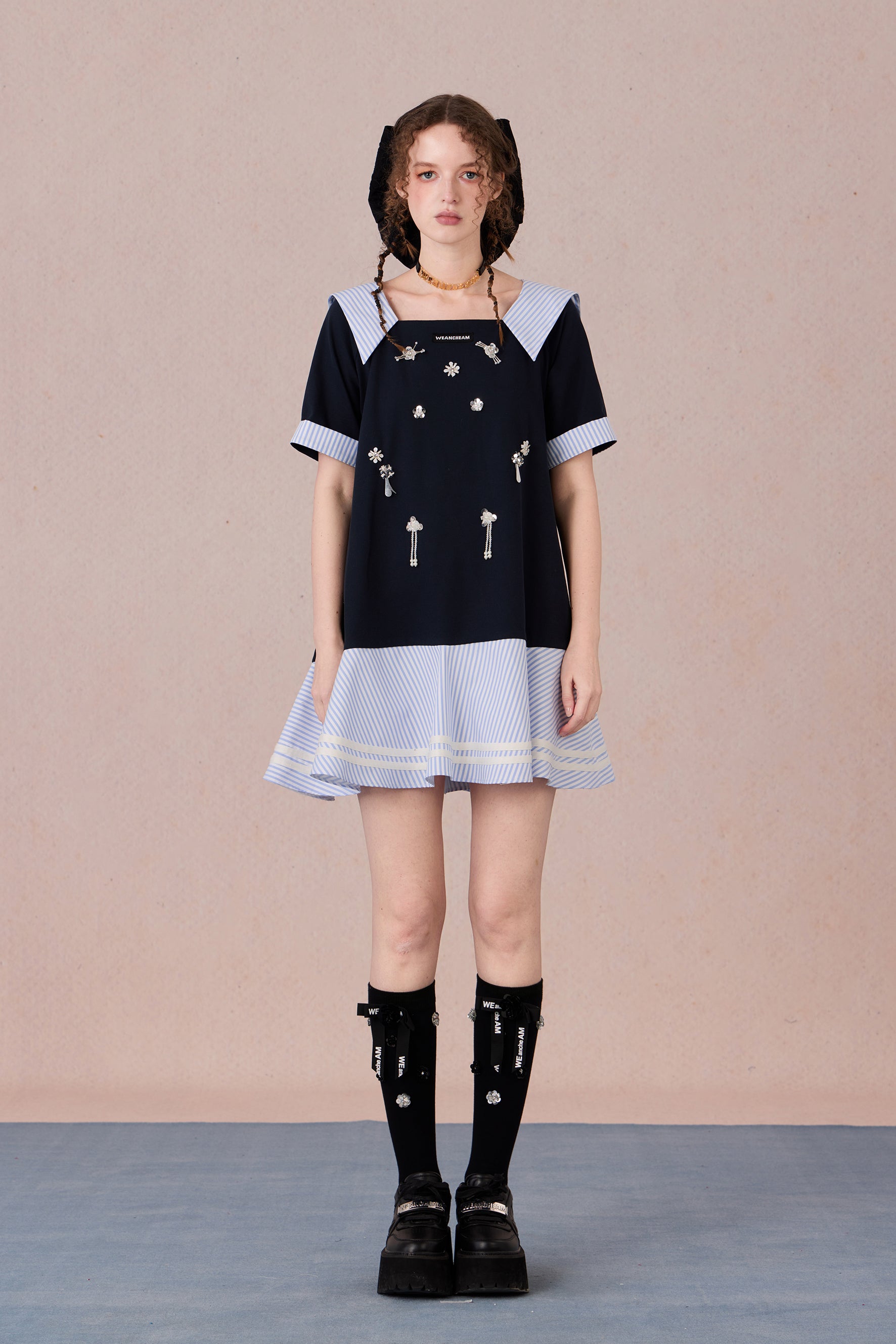 Relaxed fit floral cotton dress with navy border and romantic lace hemline