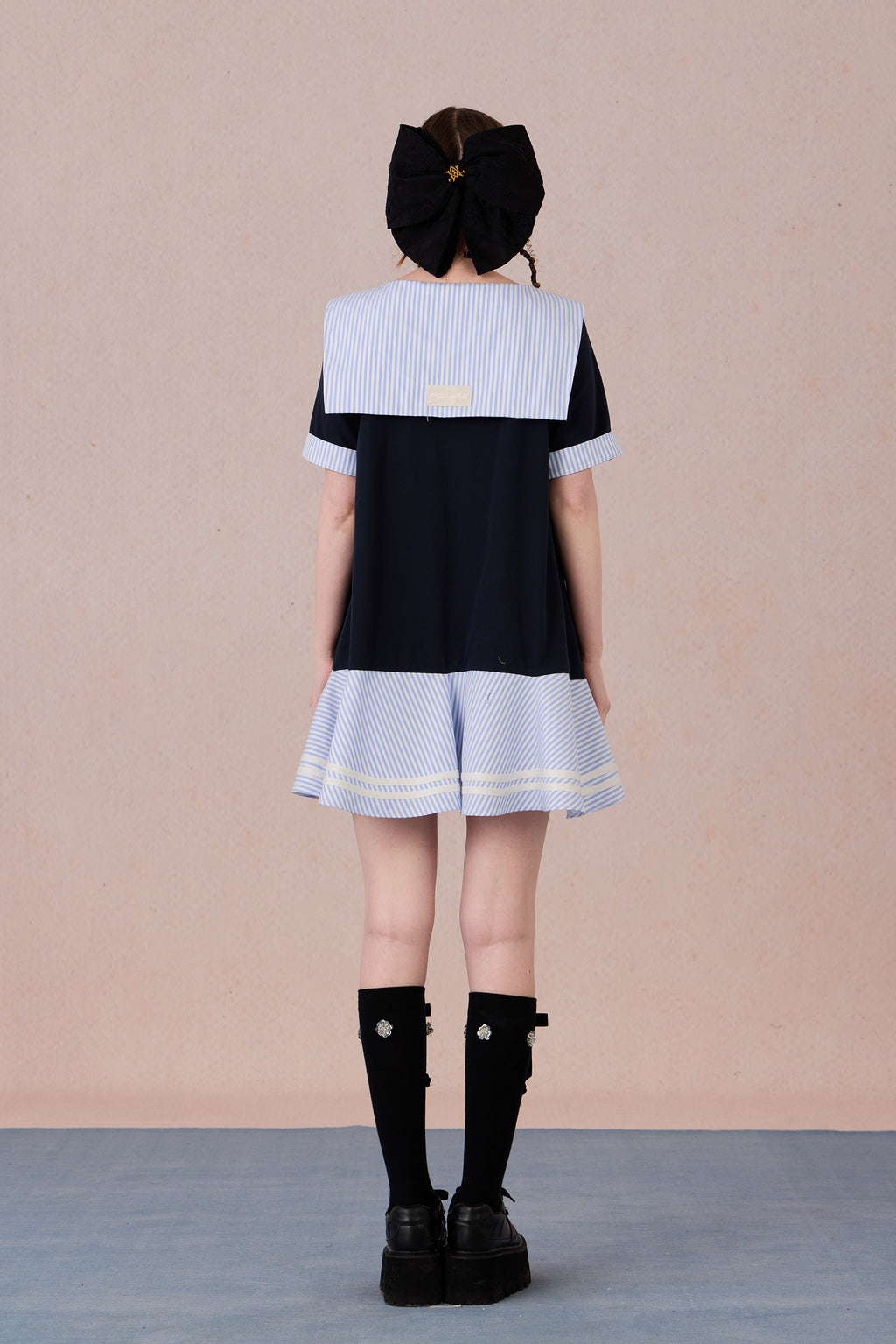 Relaxed fit floral cotton dress with navy border and romantic lace hemline