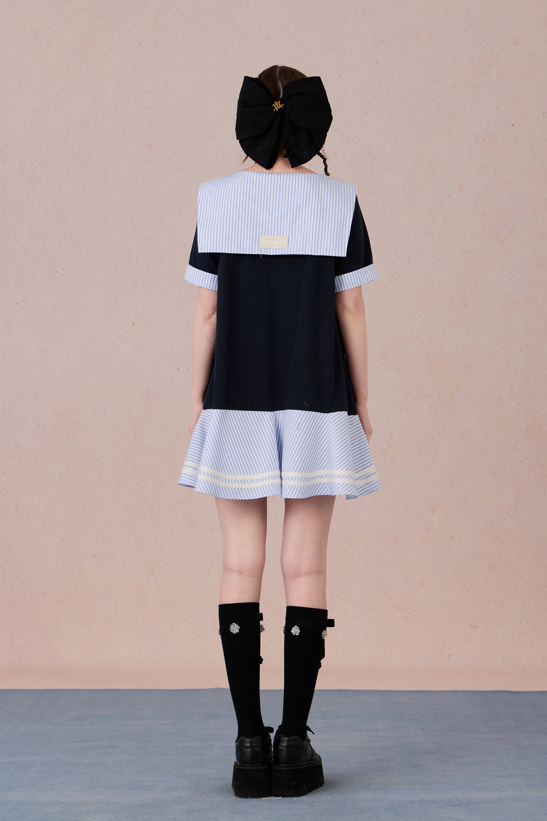Relaxed fit floral cotton dress with navy border and romantic lace hemline
