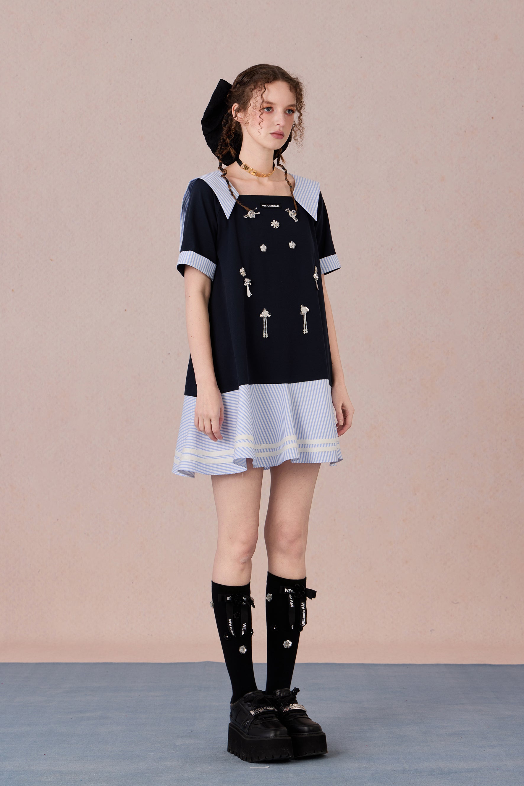 Relaxed fit floral cotton dress with navy border and romantic lace hemline