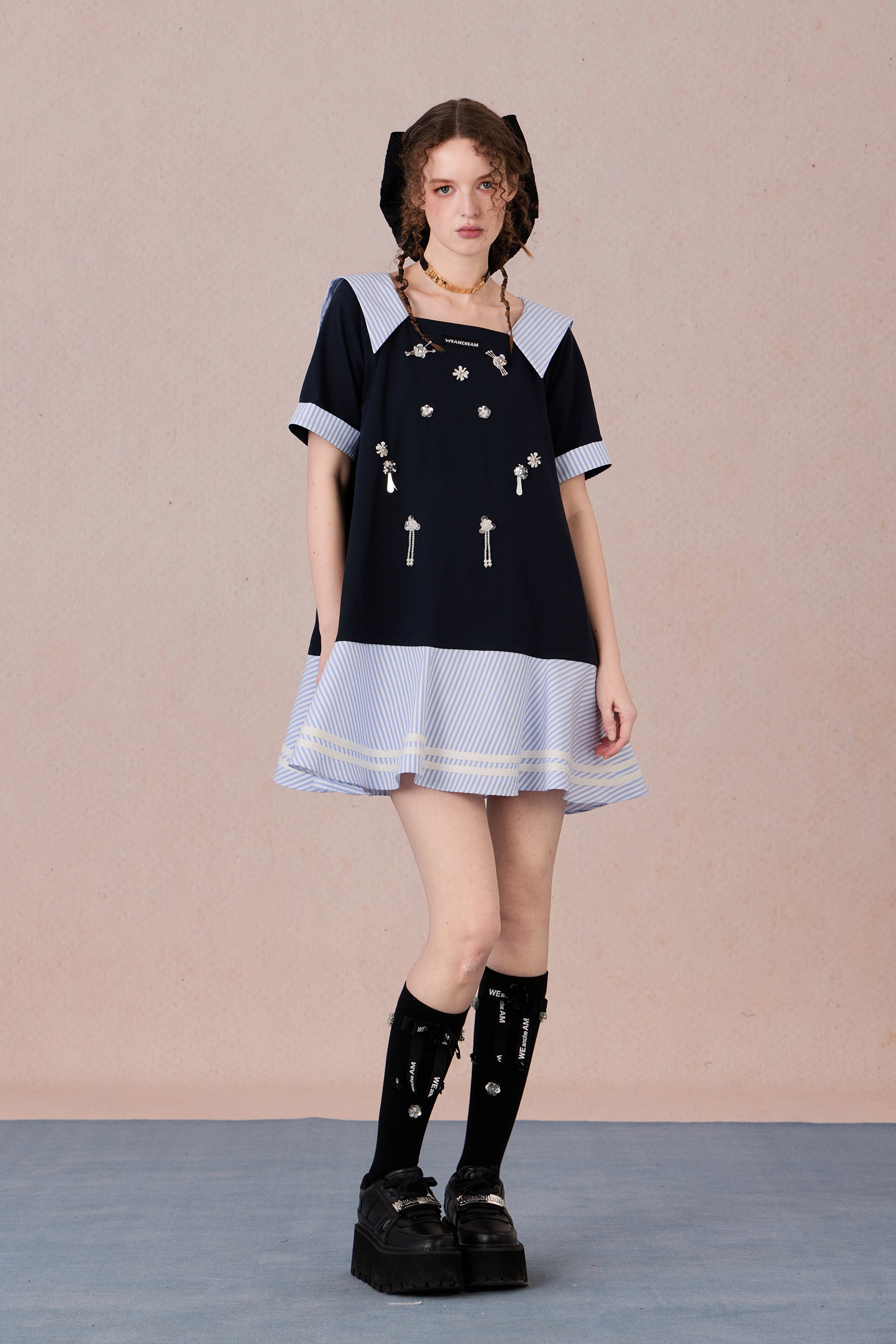 Relaxed fit floral cotton dress with navy border and romantic lace hemline