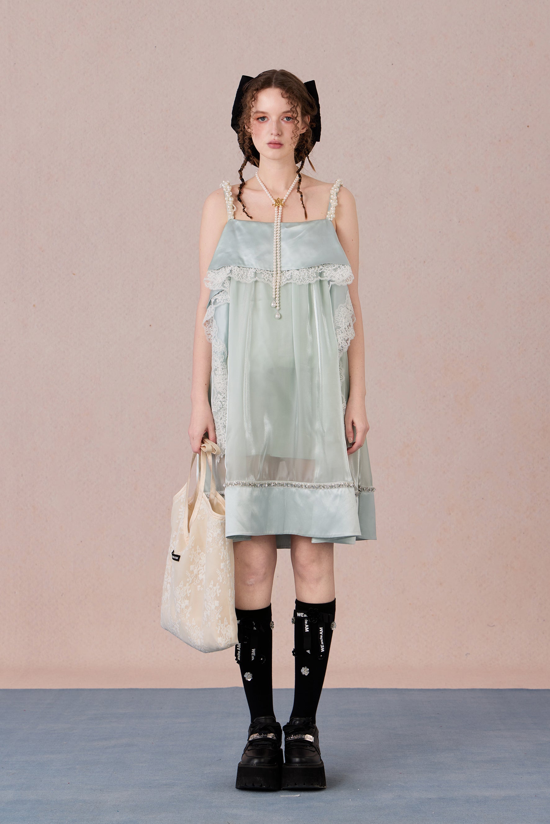 Model in strapless satin mesh dress with pearl halter – WEANCHEAM
