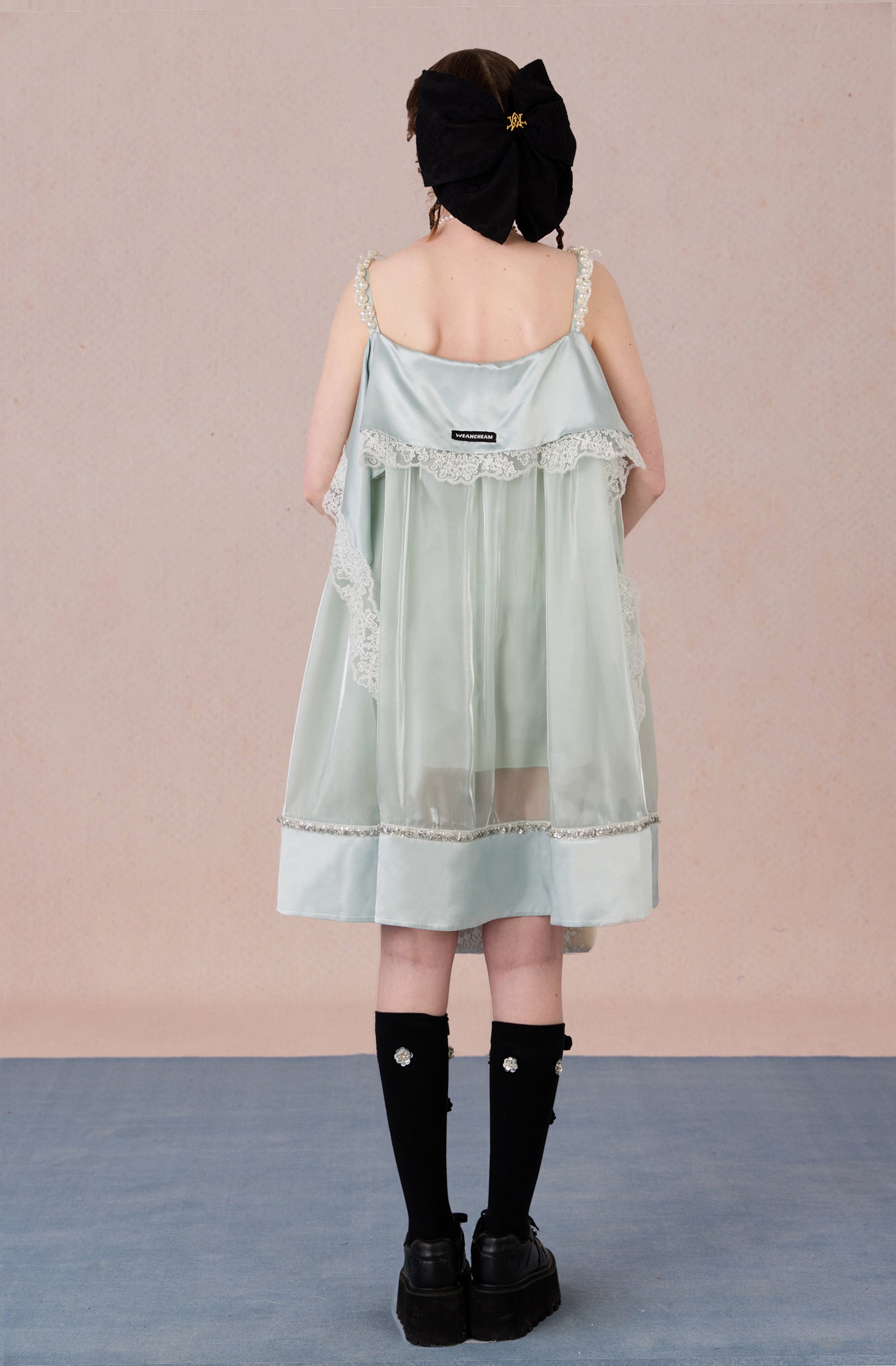 Model in strapless satin mesh dress with pearl halter – WEANCHEAM