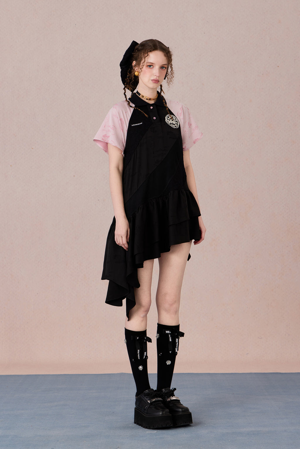 Model wearing loose-fit polo dress with layered spiral hem and embroidery – WEANCHEAM