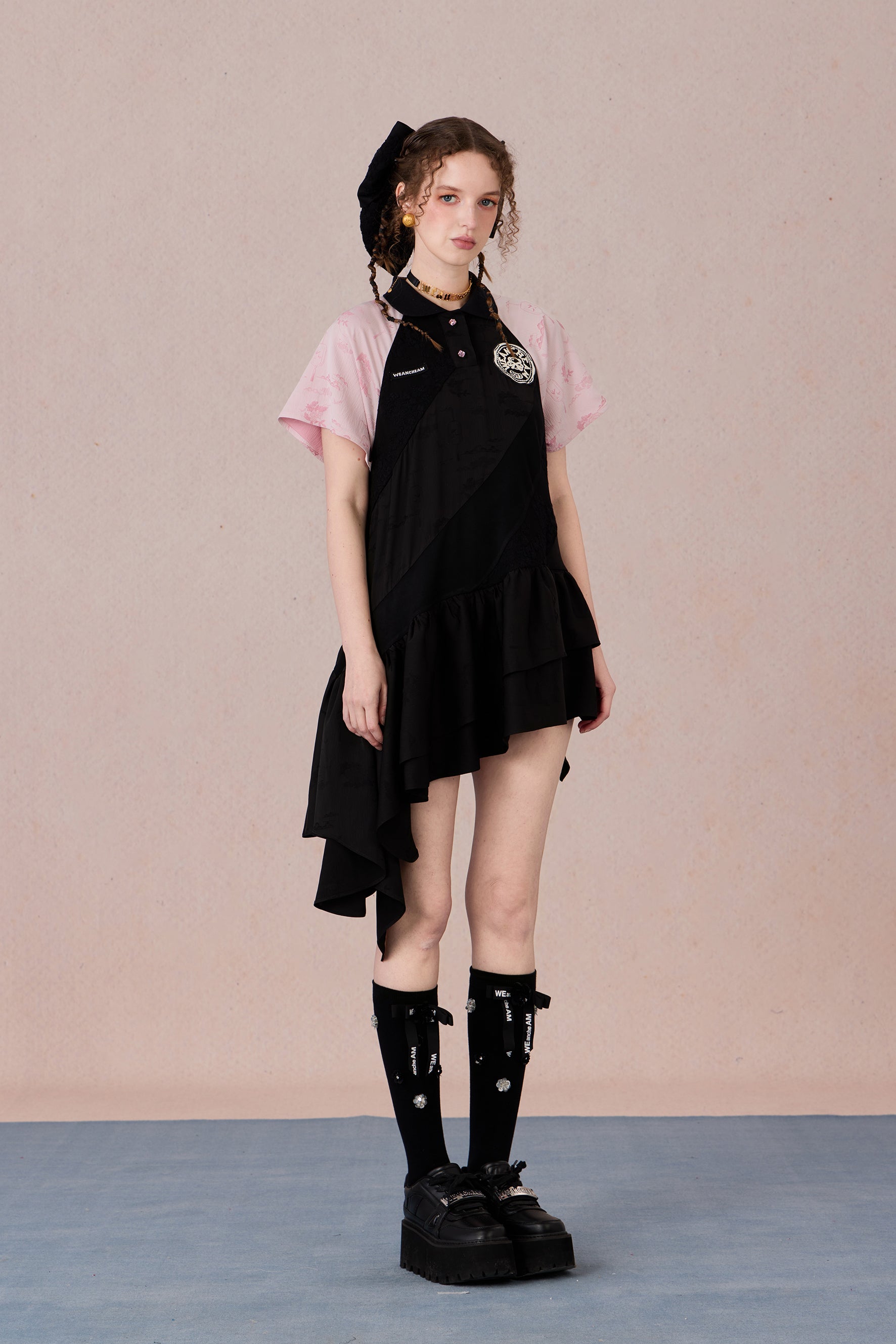 Model wearing loose-fit polo dress with layered spiral hem and embroidery – WEANCHEAM