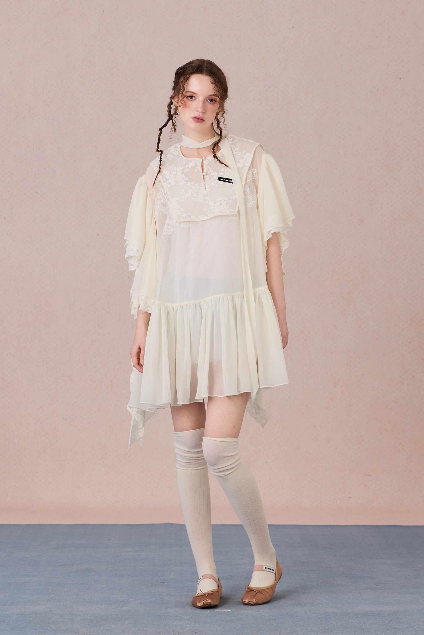 Model wearing layered chiffon dress with lace collage and short sleeves – WEANCHEAM