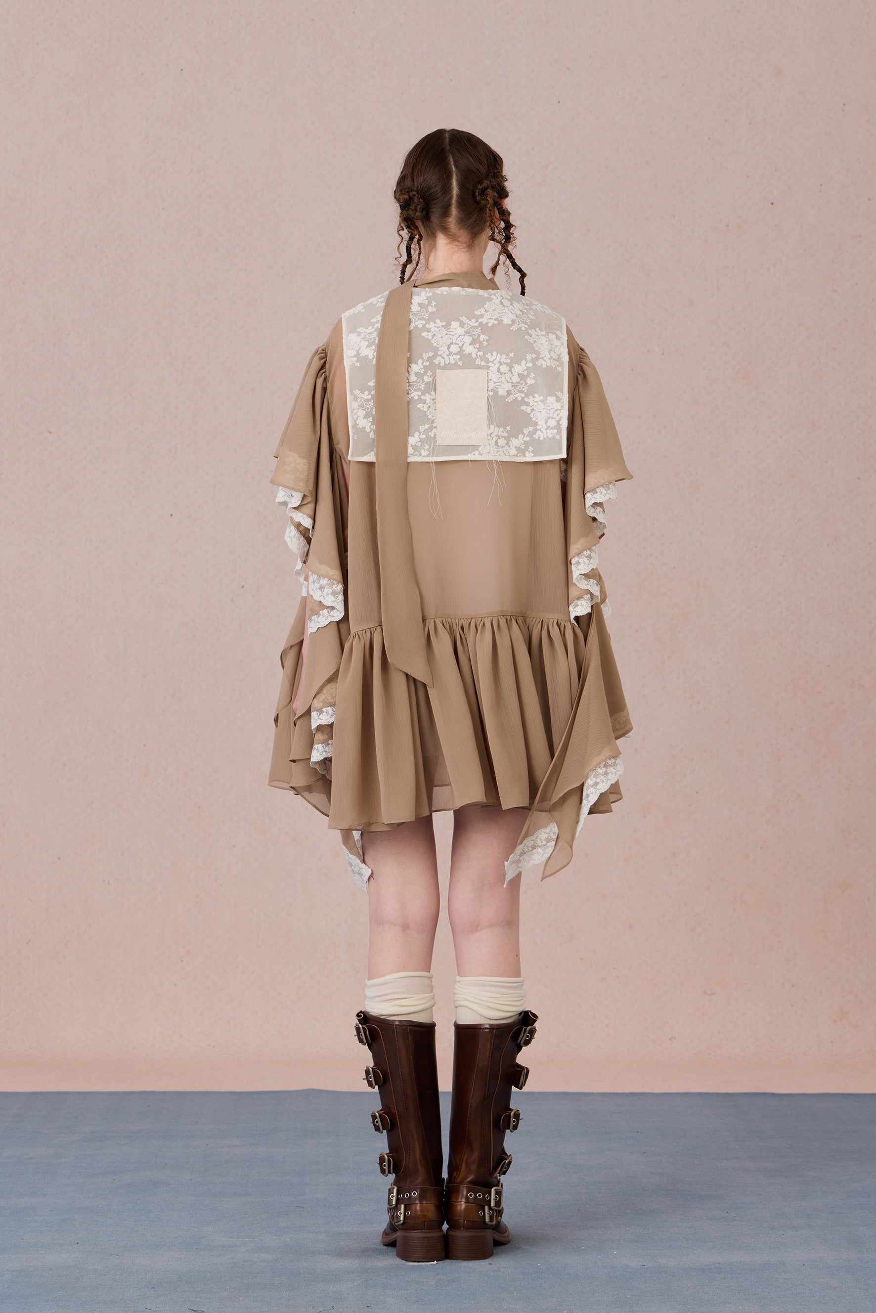 Back view of pastel chiffon spring dress with airy layered skirt