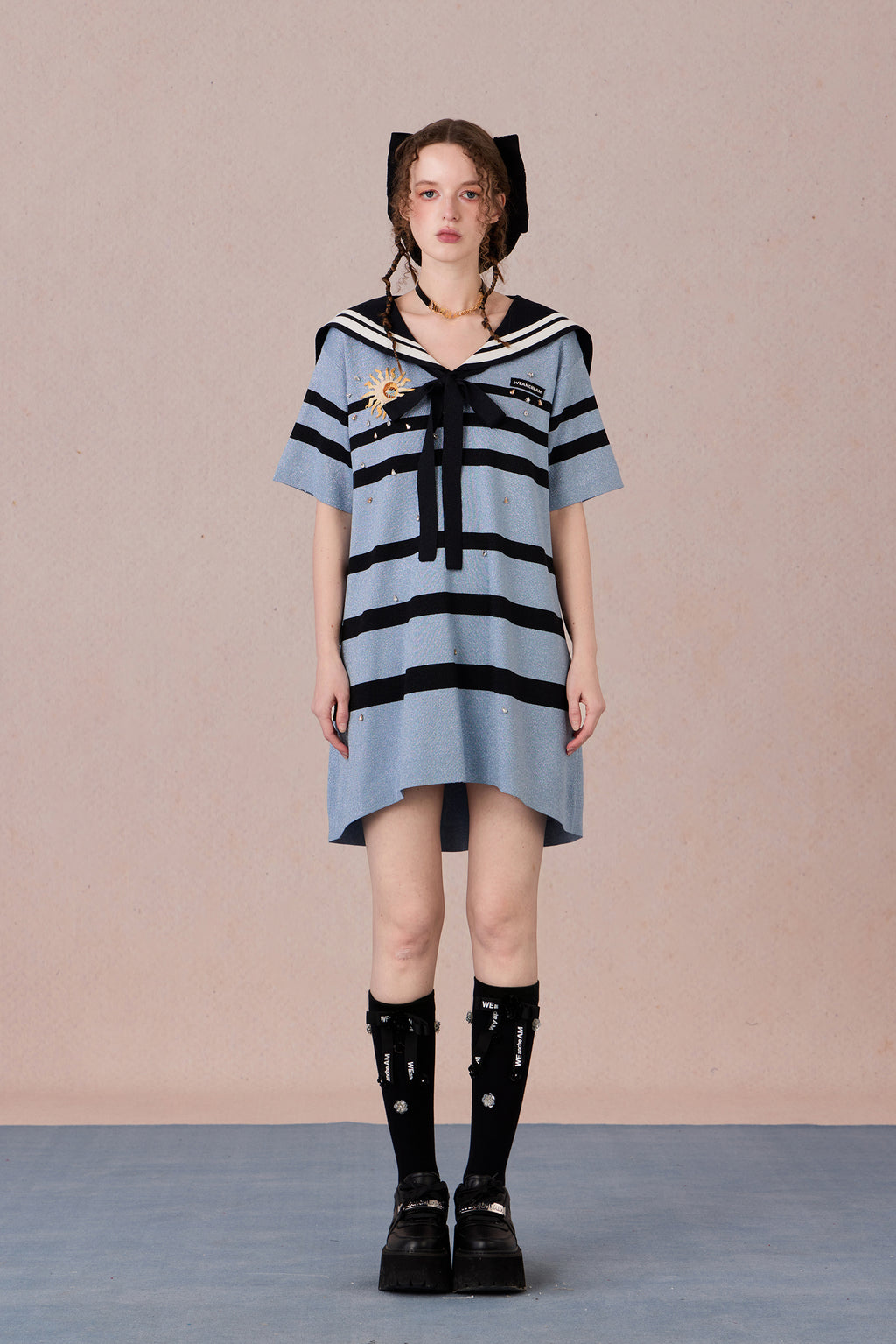 Model in nautical-style dress with embroidered bow and beadwork – WEANCHEAM