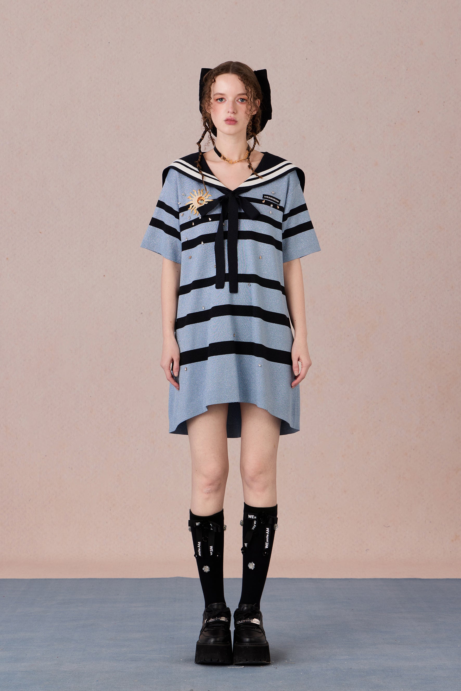 Model in nautical-style dress with embroidered bow and beadwork – WEANCHEAM
