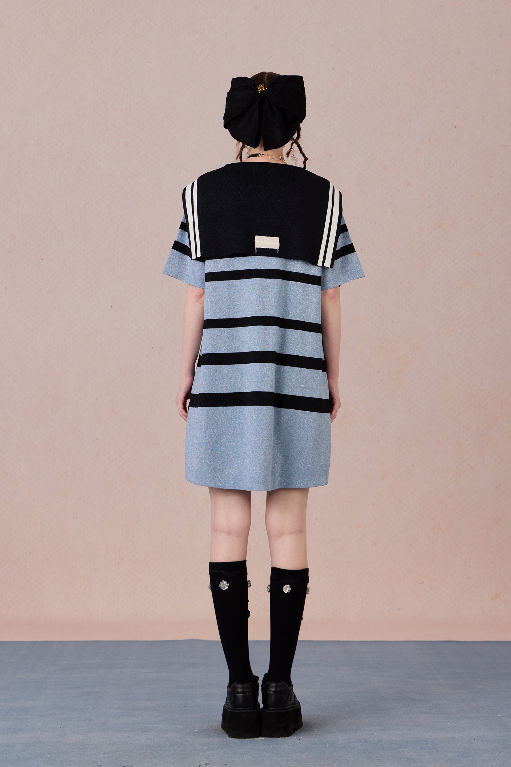 Back view of breathable striped dress with silver-thread shimmer