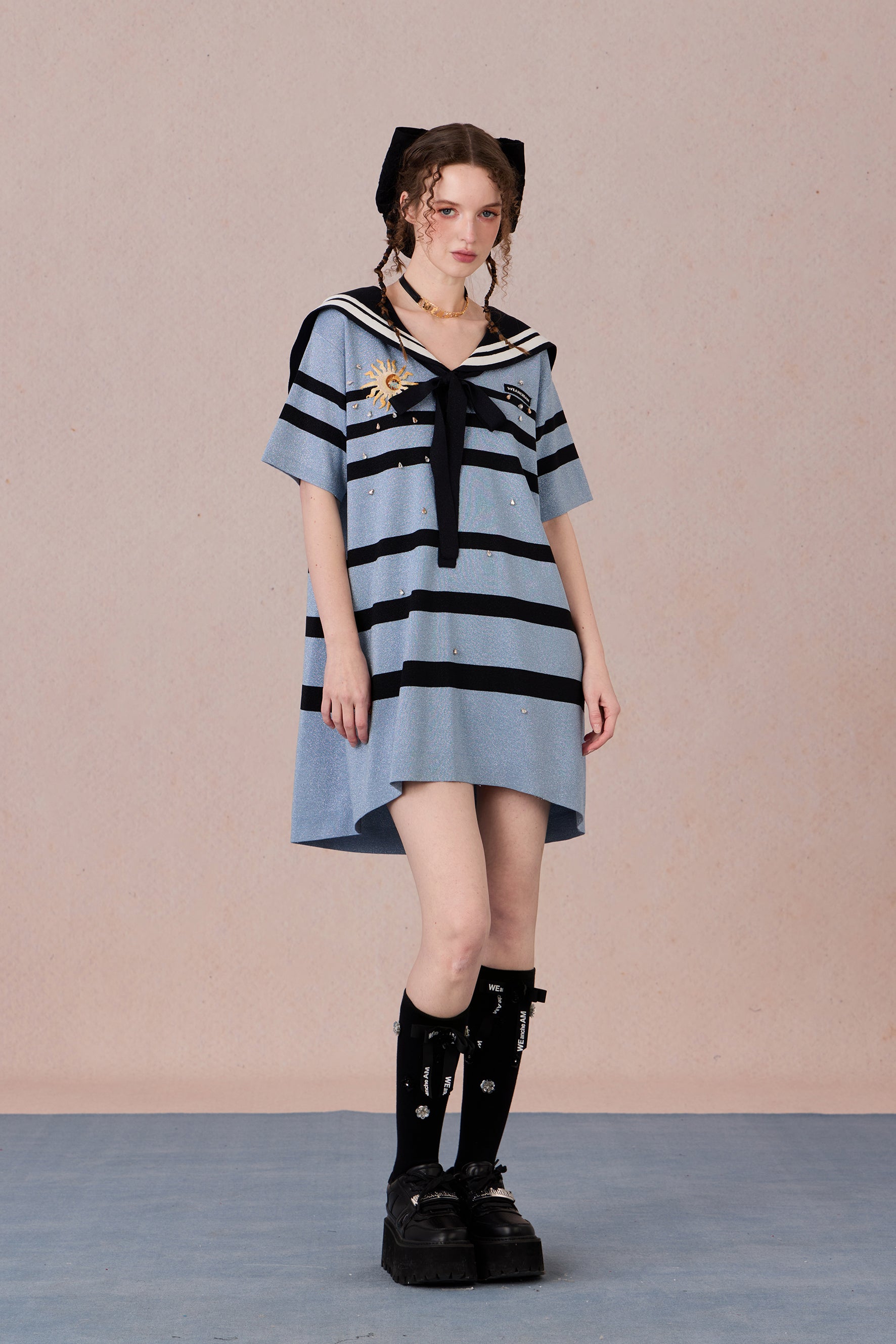 Model in nautical-style dress with embroidered bow and beadwork – WEANCHEAM