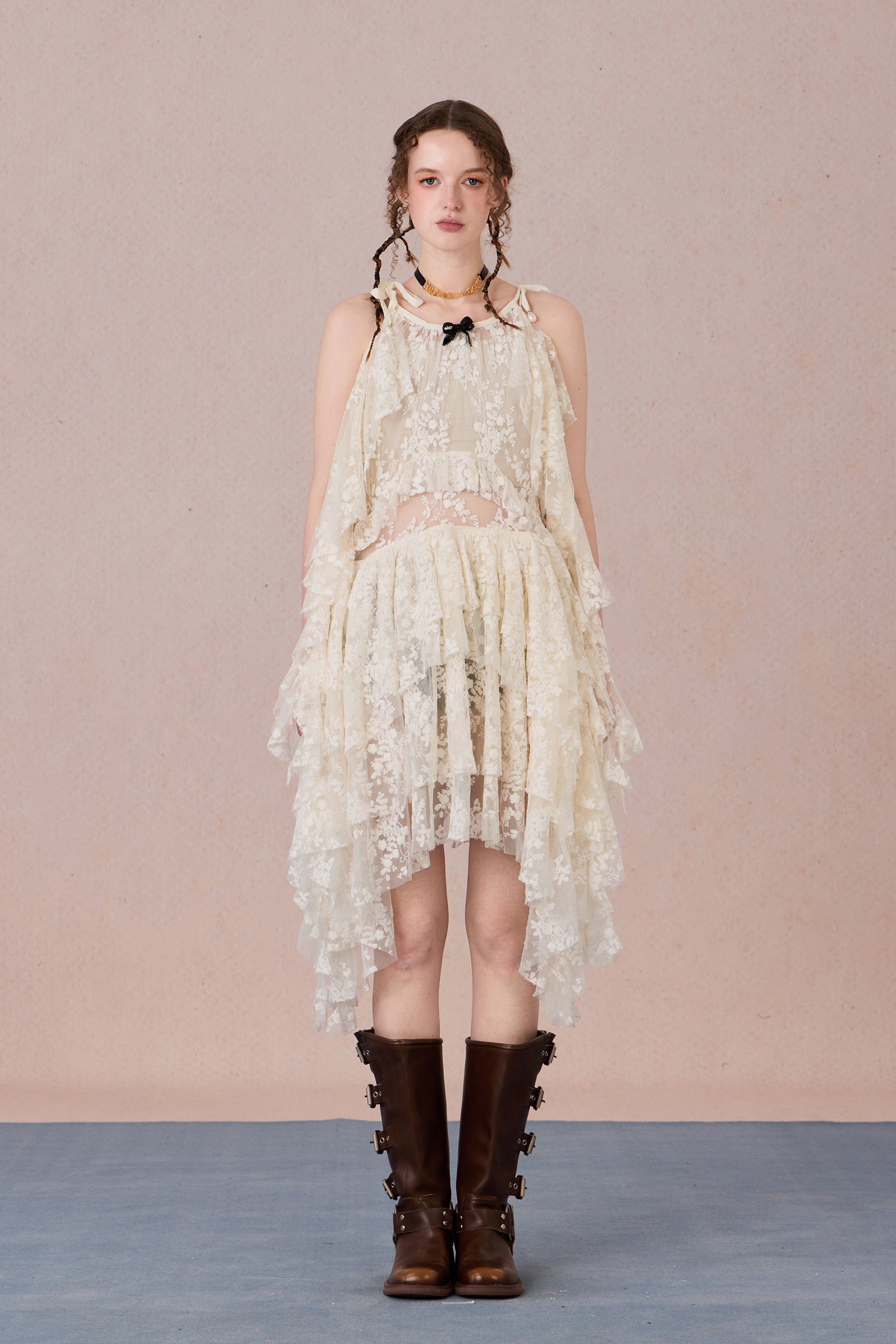 Model in fluttering battle-damaged lace dress with ruffled layers – WEANCHEAM