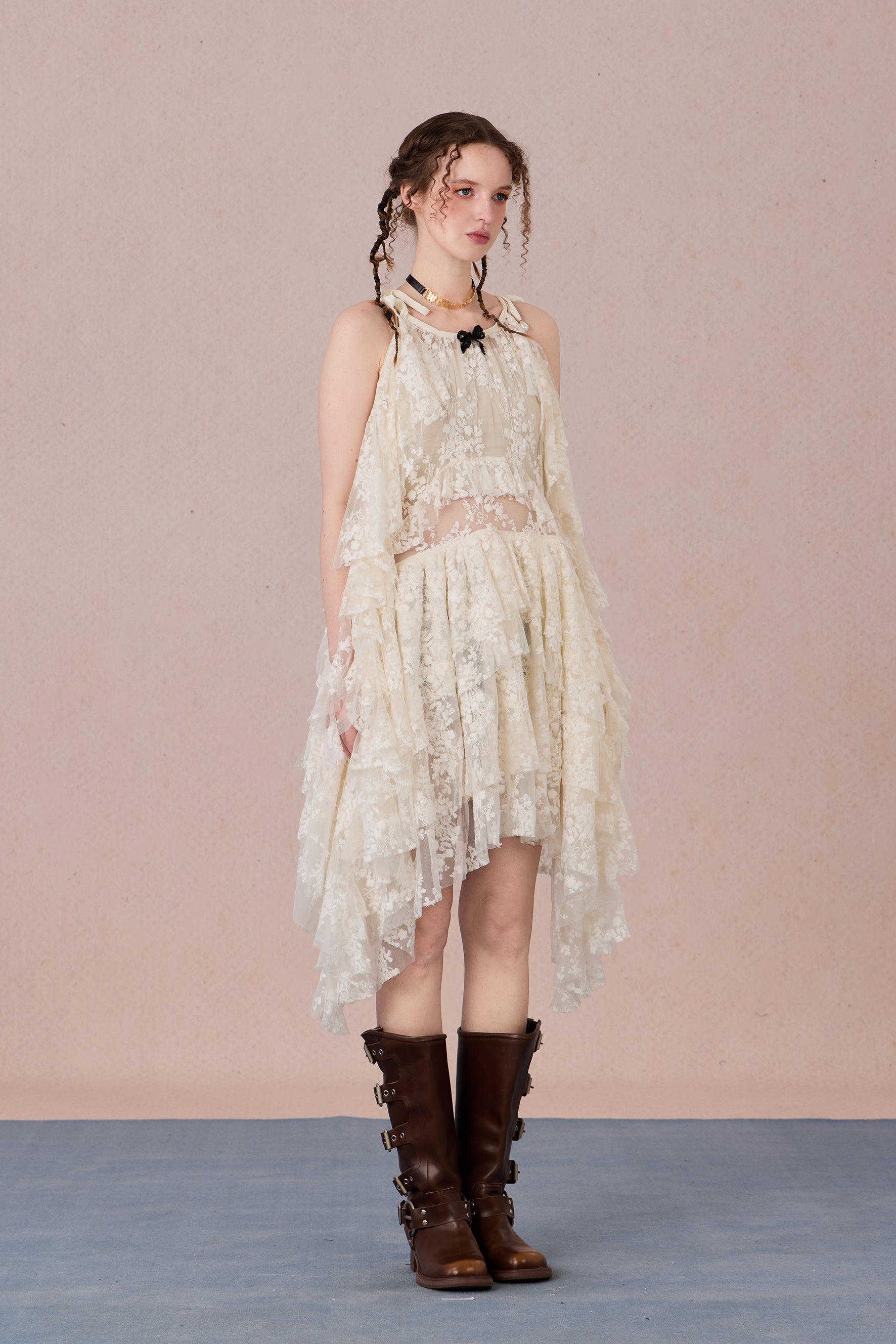 Model in fluttering battle-damaged lace dress with ruffled layers – WEANCHEAM